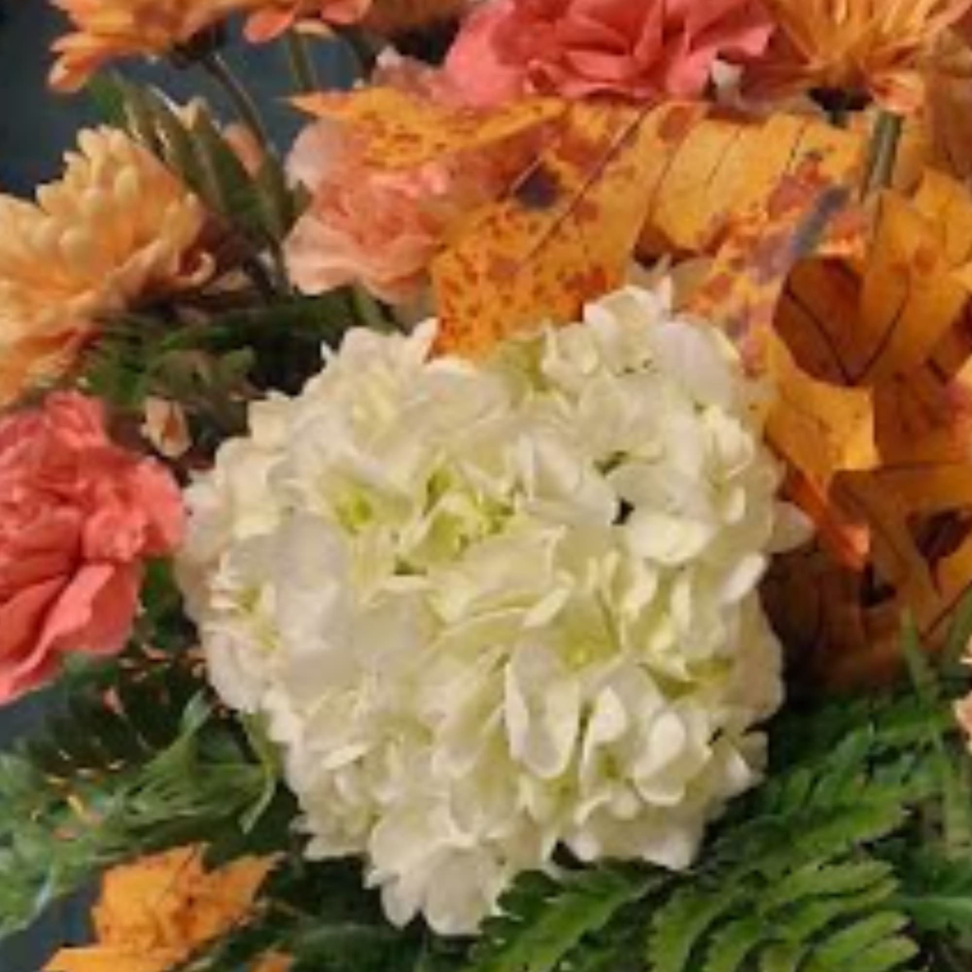 Bouquet of white hydrangea with orange and pink flowers