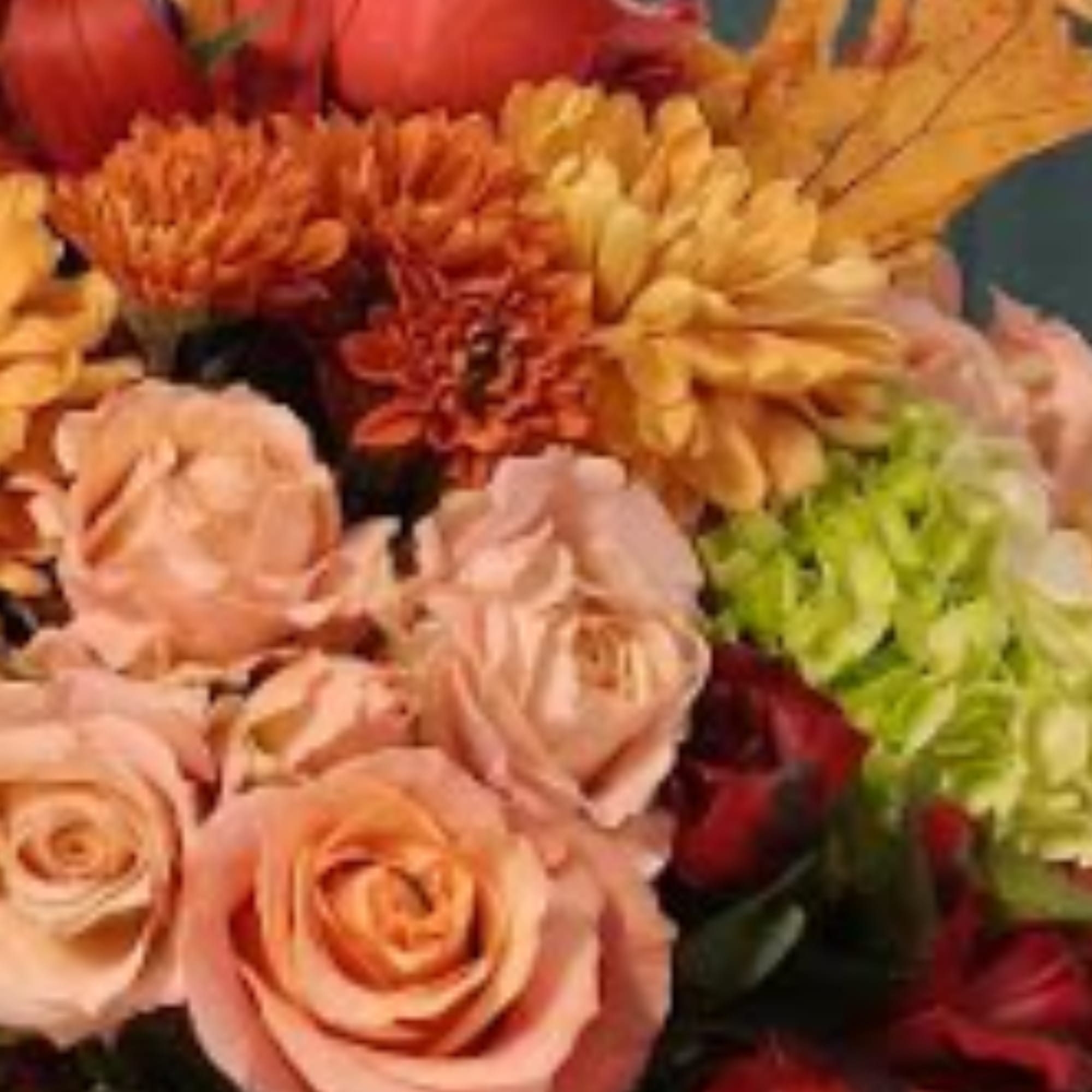 Bouquet of peach roses and orange chrysanthemums with yellow blooms