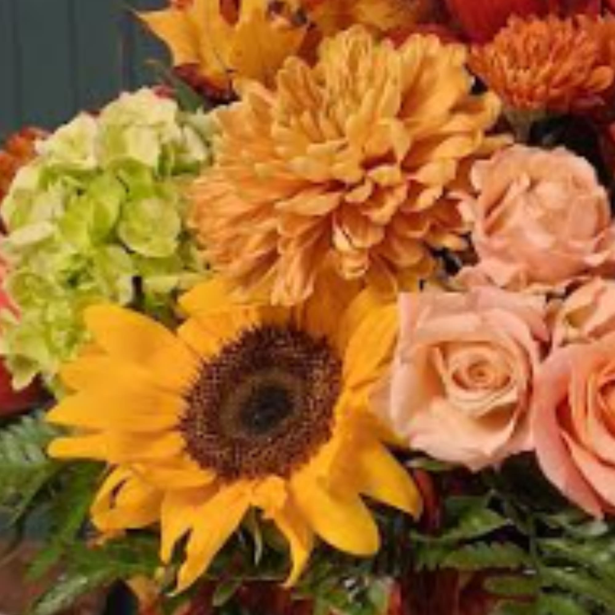 Bouquet with sunflowers, orange mums, and peach roses