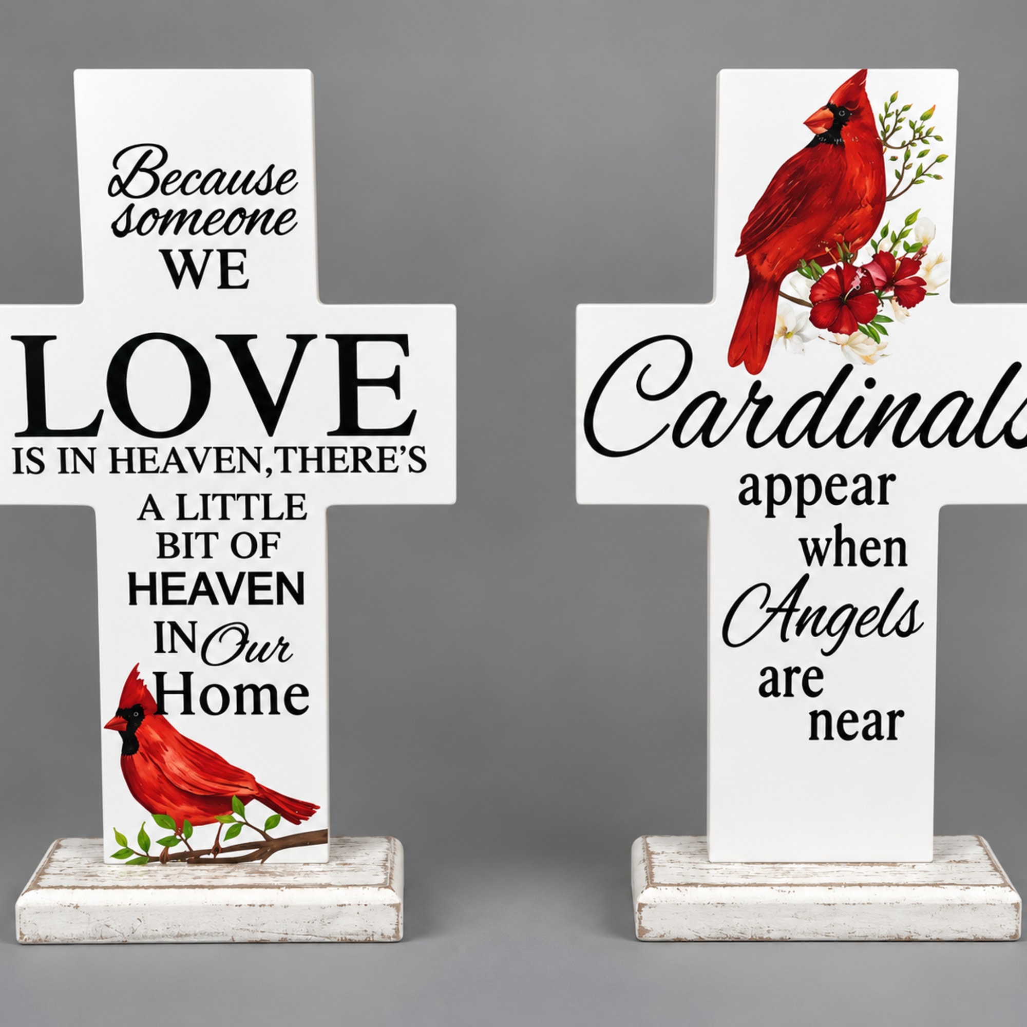 Two white memorial cross signs with cardinal and sympathy text