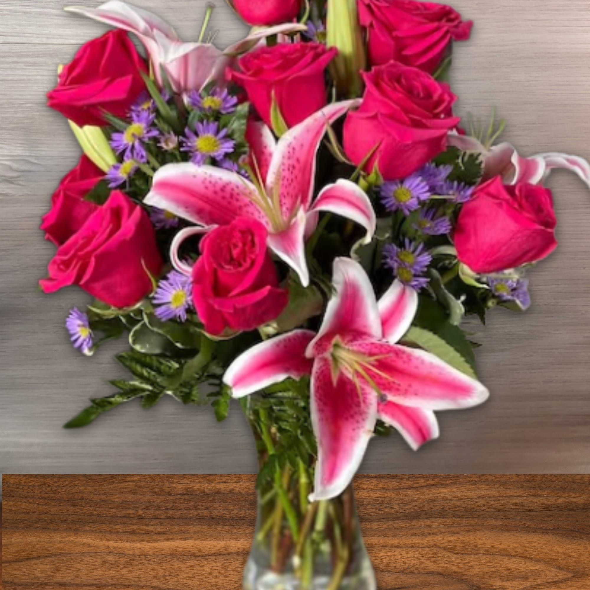 Striking stargazers arrangement featuring stargazers Lillie&rsquo;s, and pink roses. 