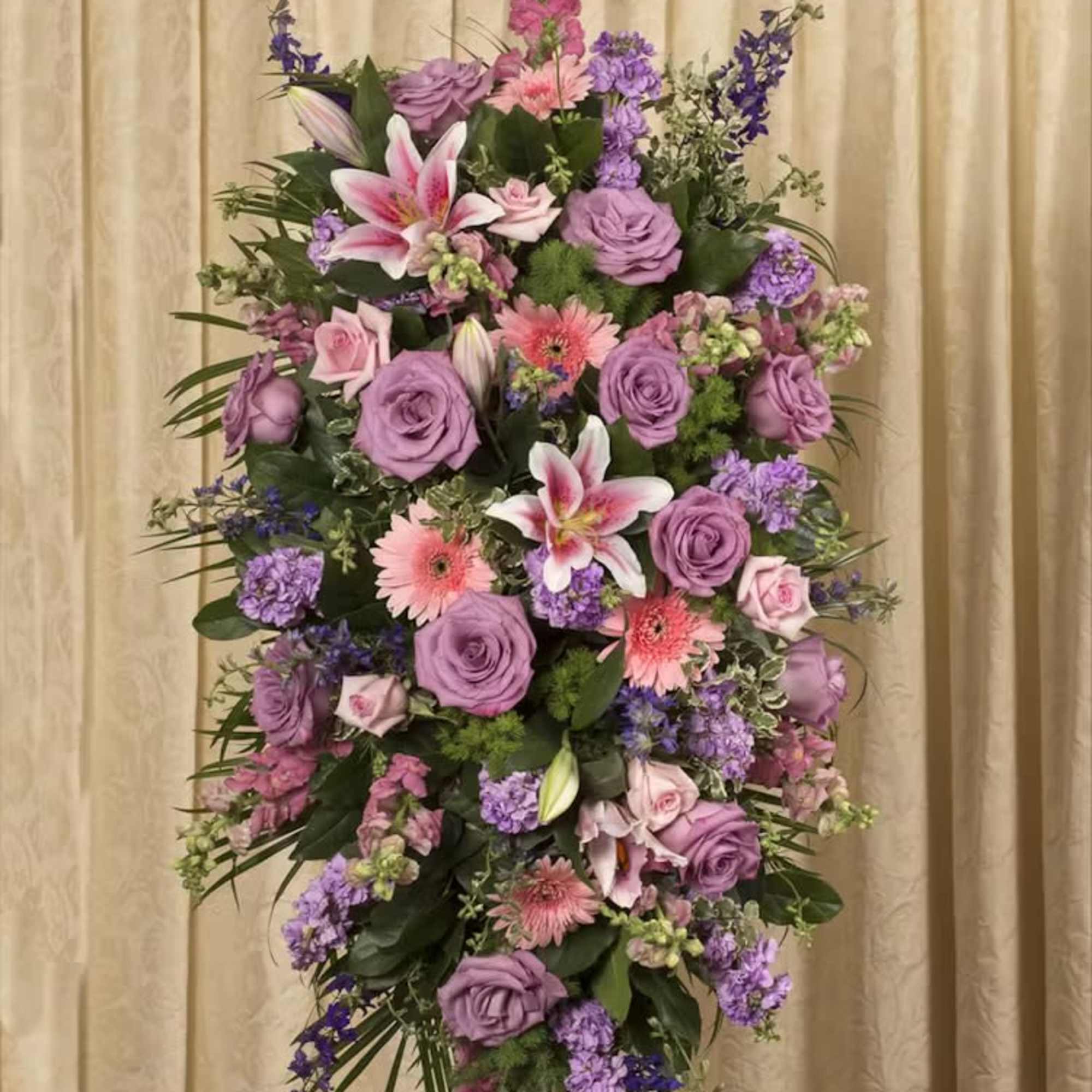 Tall standing floral spray with pink and purple flowers