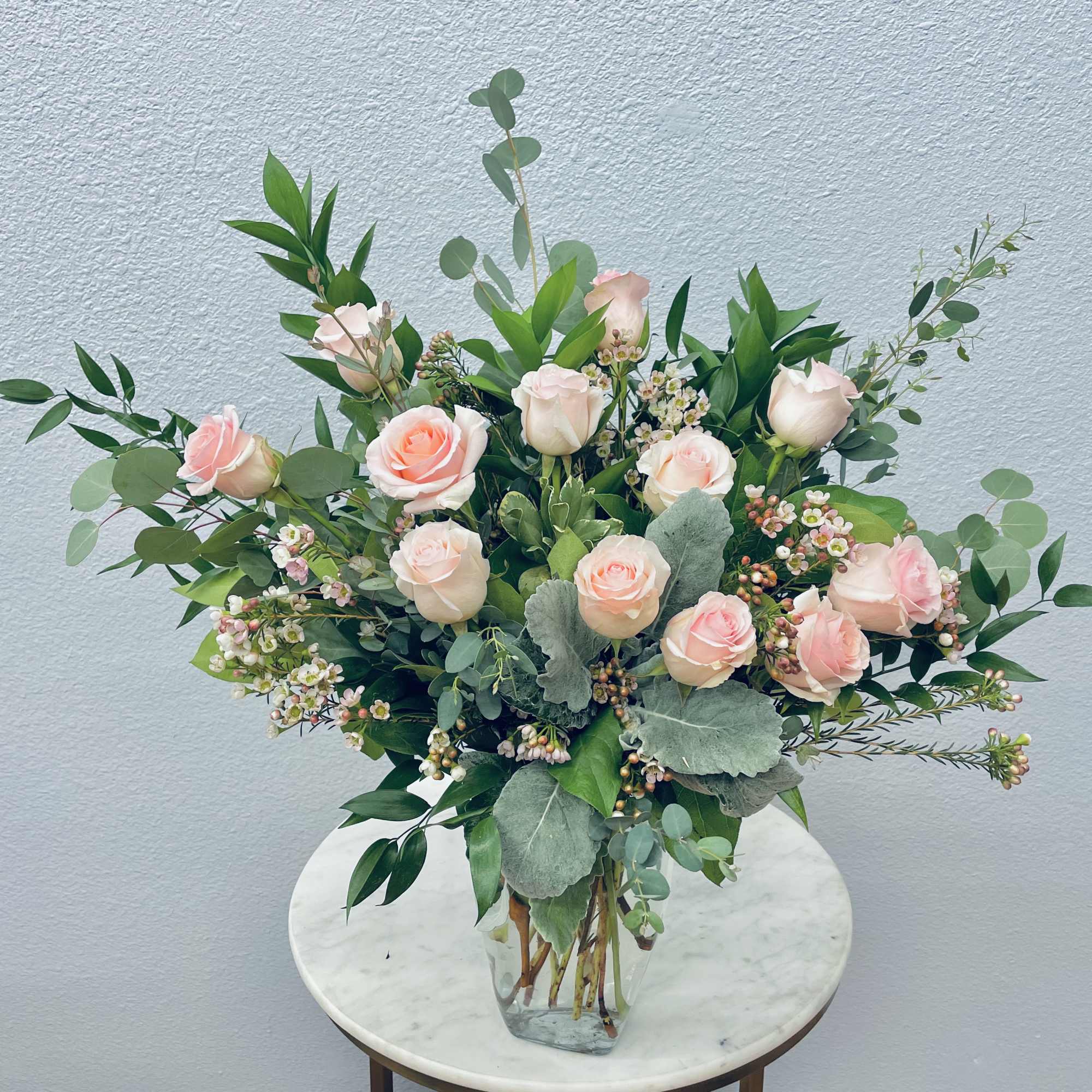 Color Palette: pastel roses
One dozen premium roses tucked into botanical eucalyptus and
