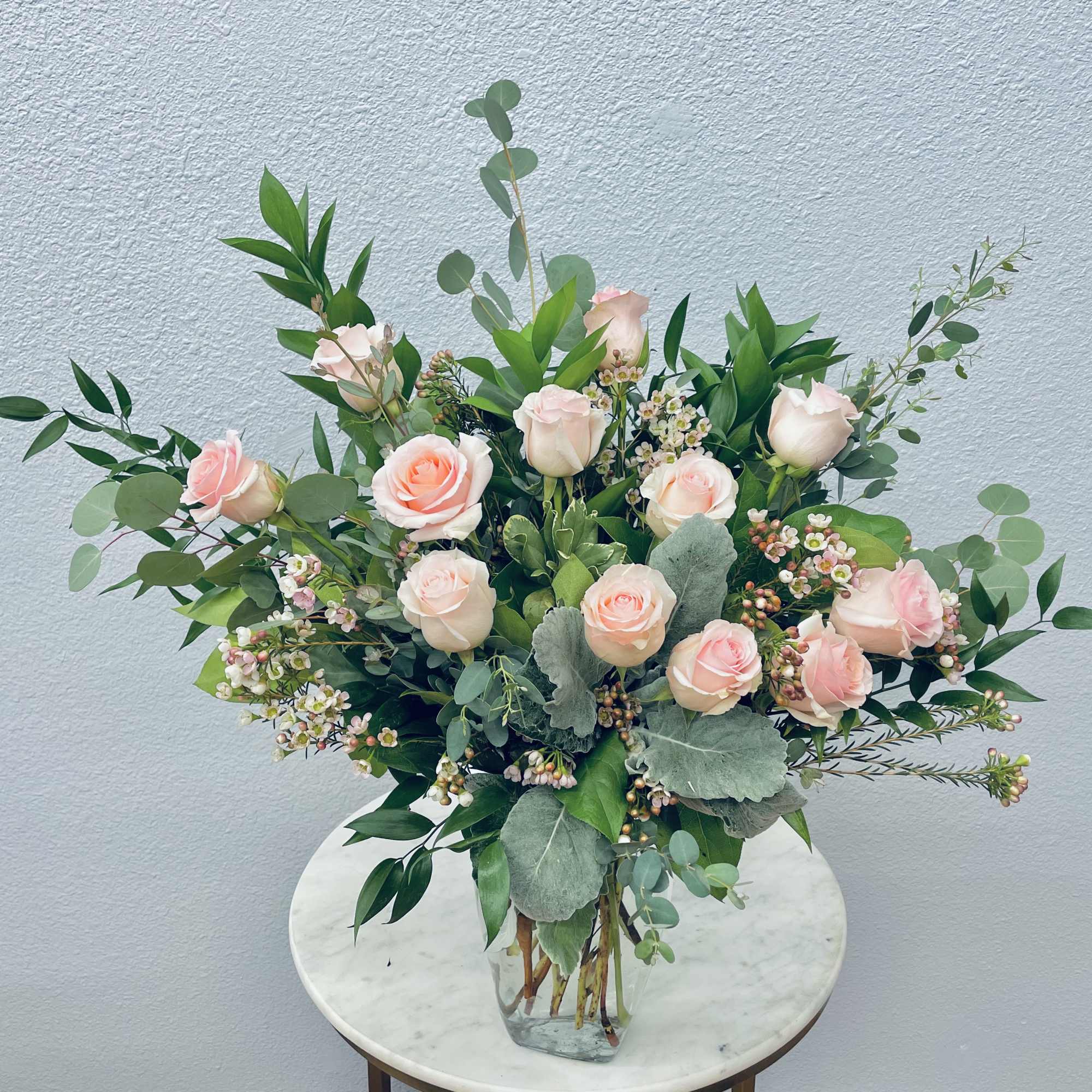 Color Palette: pastel roses
One dozen premium roses tucked into botanical eucalyptus and, photo 3 of 3
