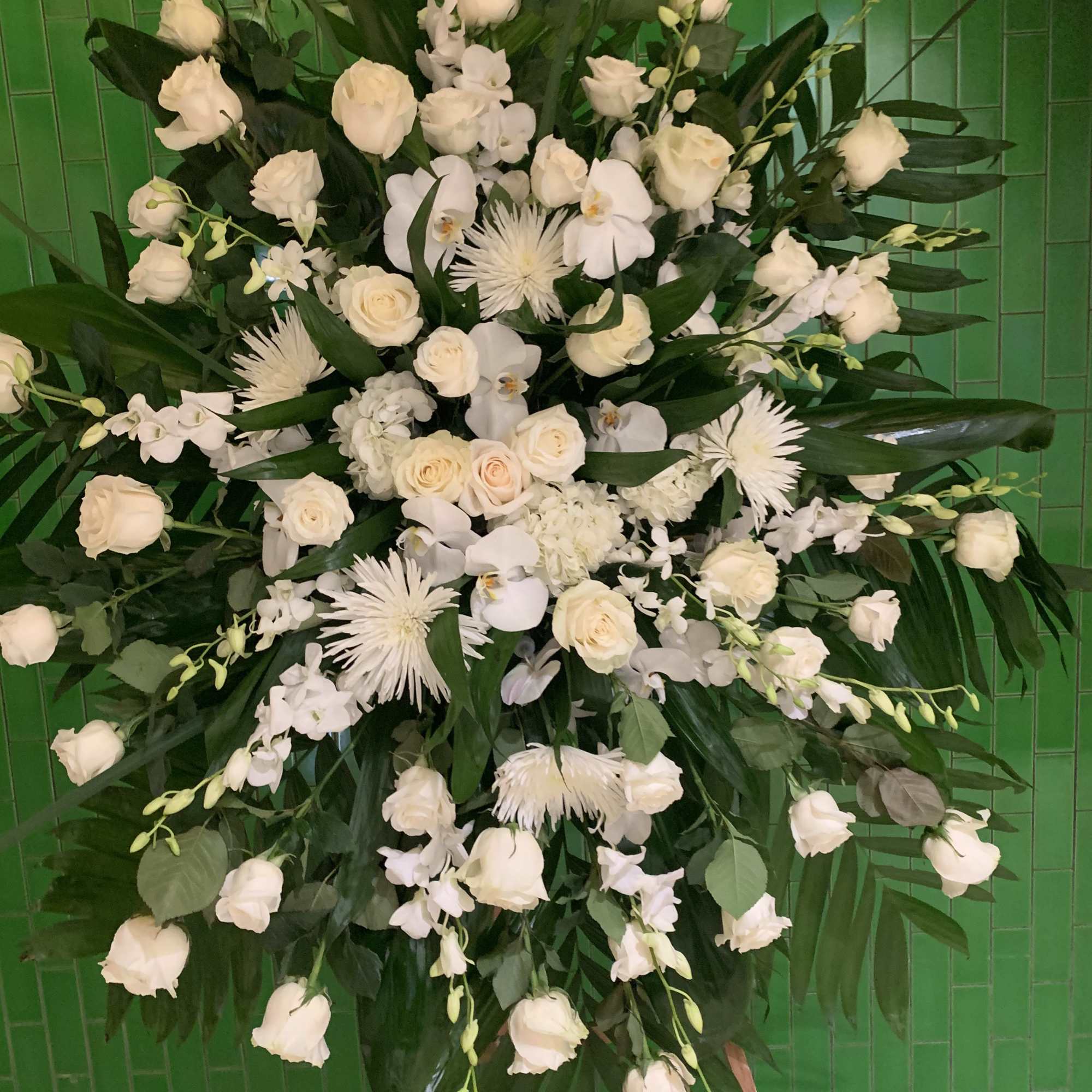Large white floral standing spray with roses and orchids, photo 3 of 4