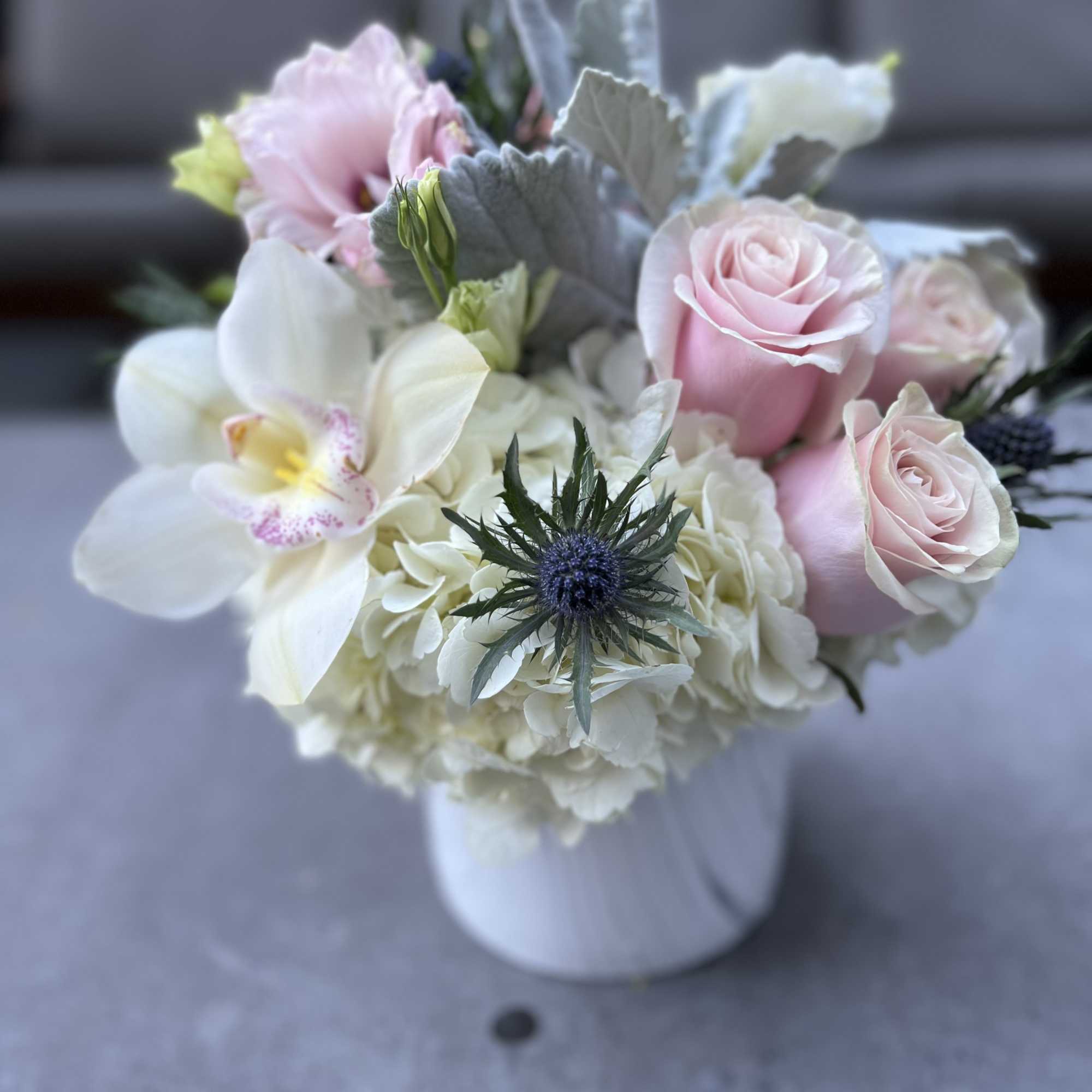 Pink roses and white orchids in a white vase, photo 4 of 4