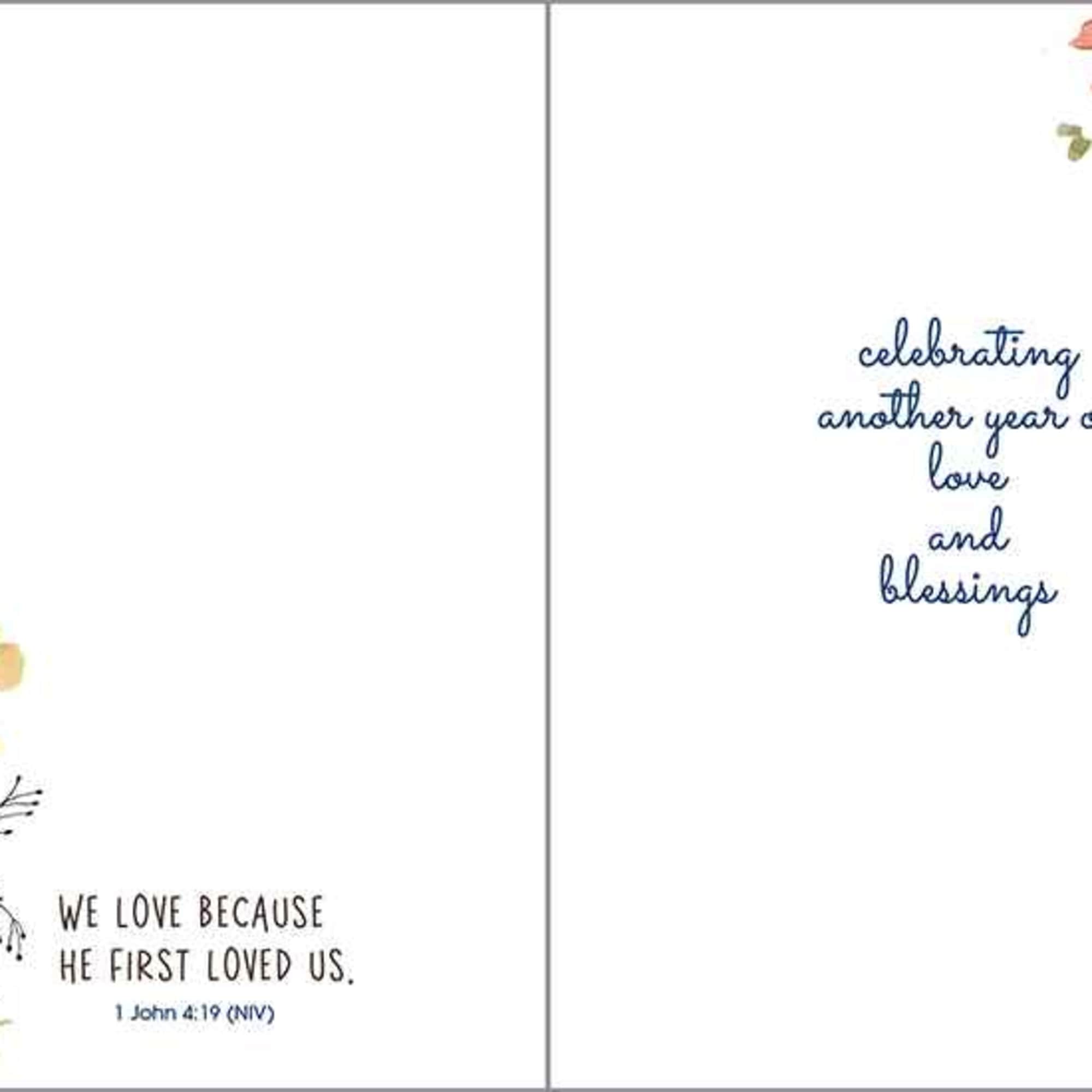Greeting card with envelope reads:

Front: "Happy Anniversary"
Inside: "Celebrating another year of love, photo 2 of 2