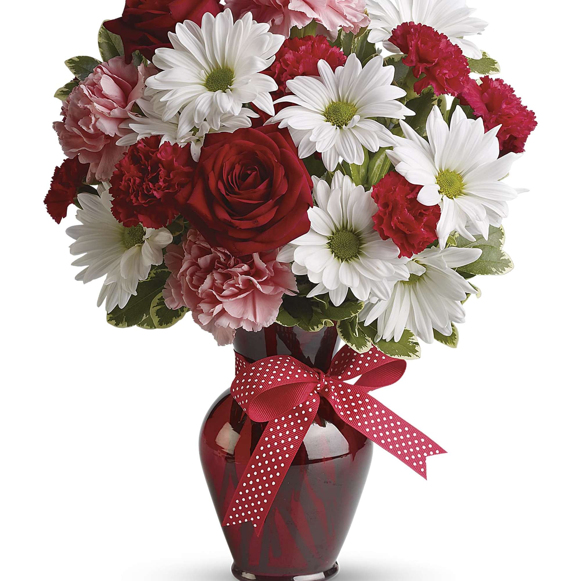 Red and white bouquet in a red vase with a polka-dot ribbon