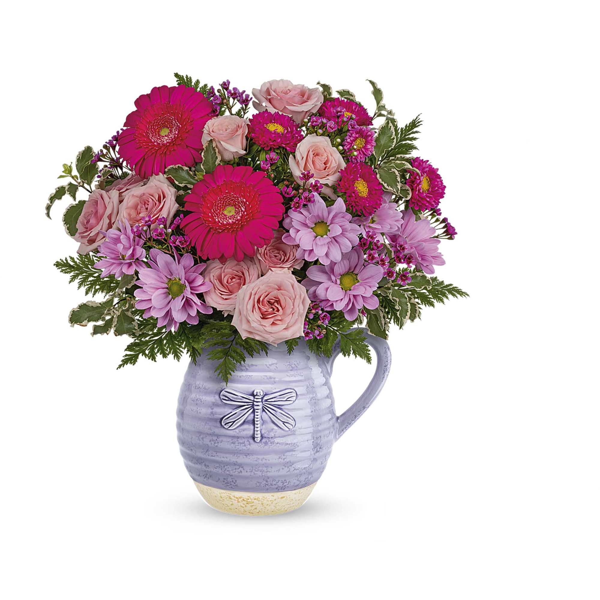 Pink and lavender flowers arranged in a lavender pitcher vase