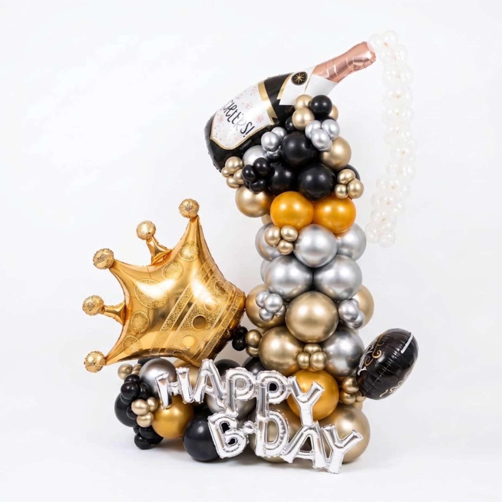 Birthday balloon arrangement with a gold crown and silver "Happy B-Day" letters