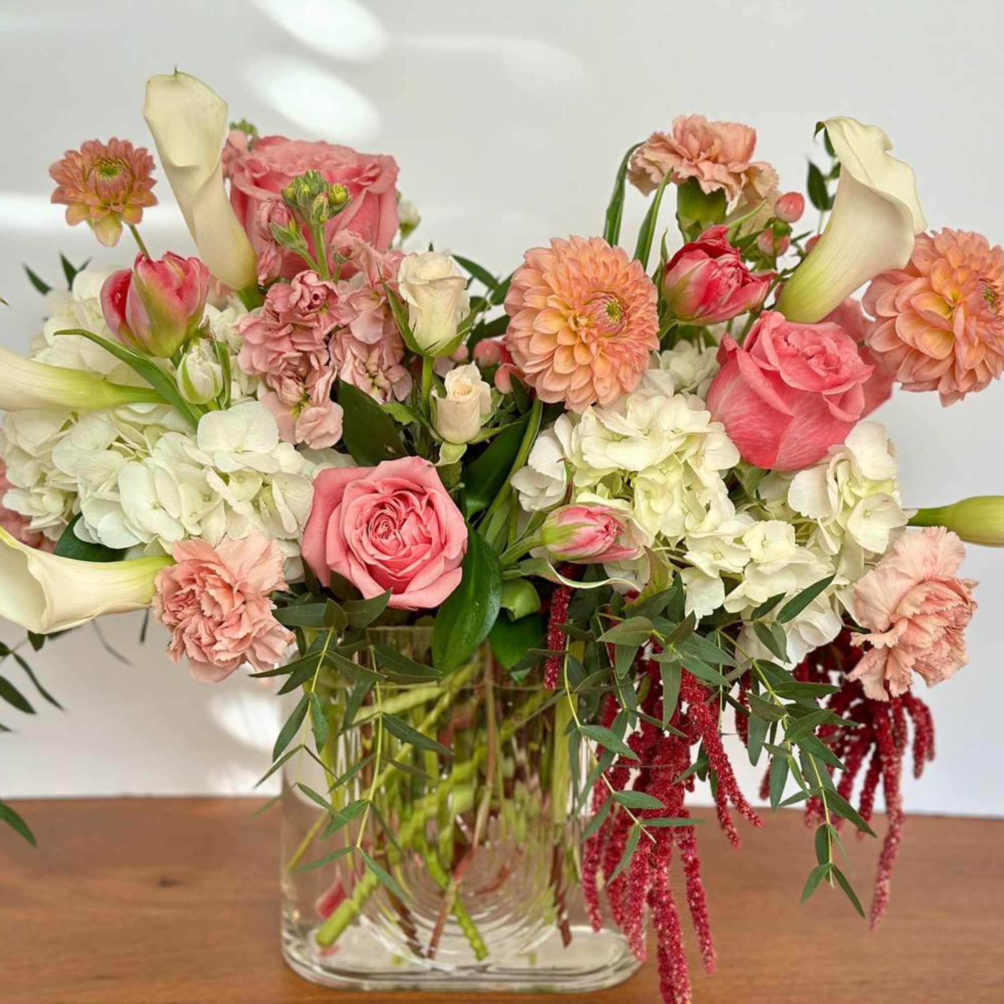 Pink and white mixed bouquet in a clear glass vase