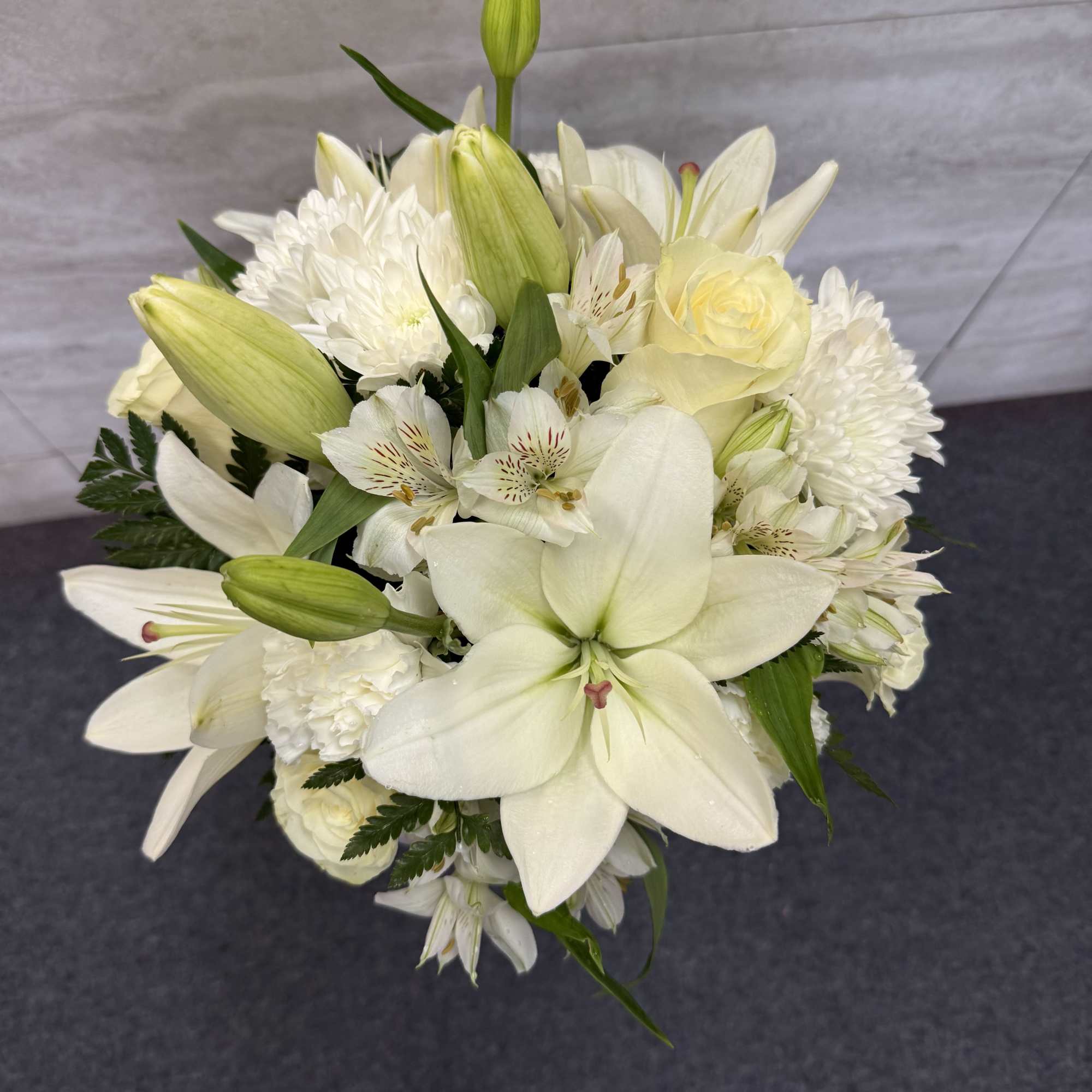 (ALL-ROUND) A dreamy all-white bouquet featuring elegant roses, soft cushions, and graceful, photo 2 of 2