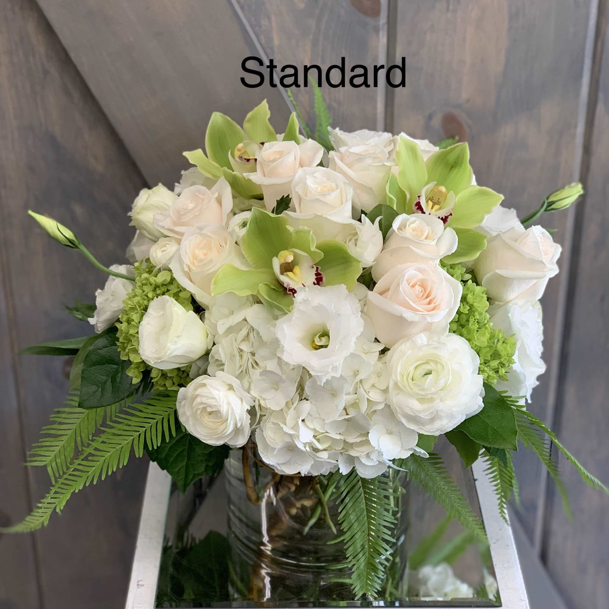 This elegant and sophicated floral display includes Umbrella fern, White hydrangea, White, photo 2 of 2