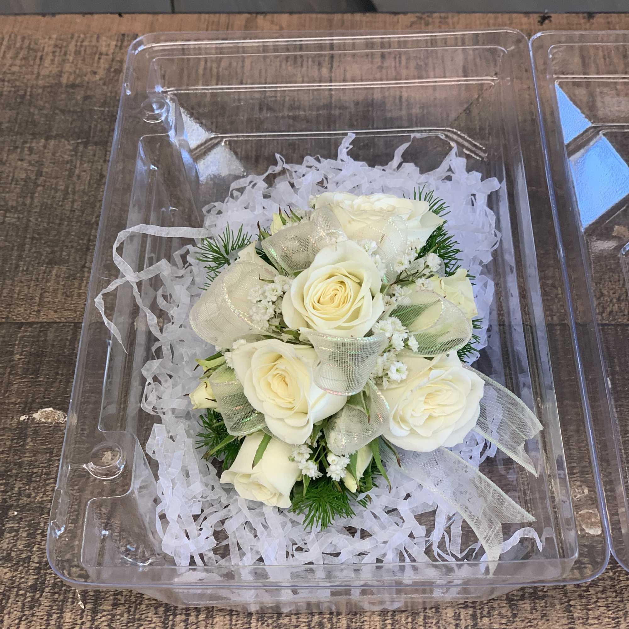 Cream rose bouquet in a clear plastic gift box