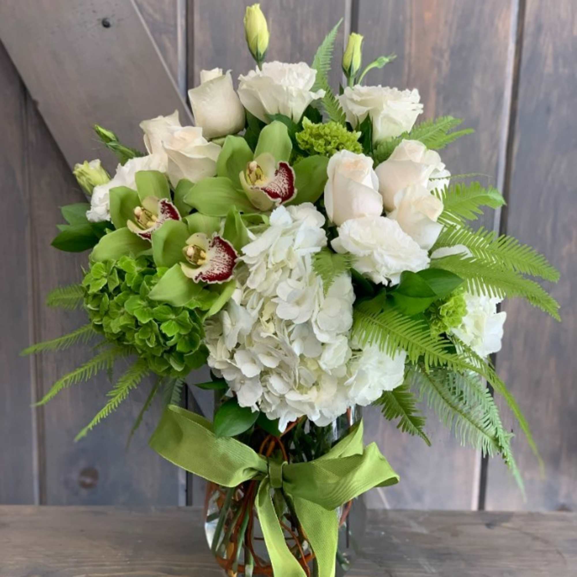 This elegant and sophicated floral display includes Umbrella fern, White hydrangea, White, photo 2 of 2