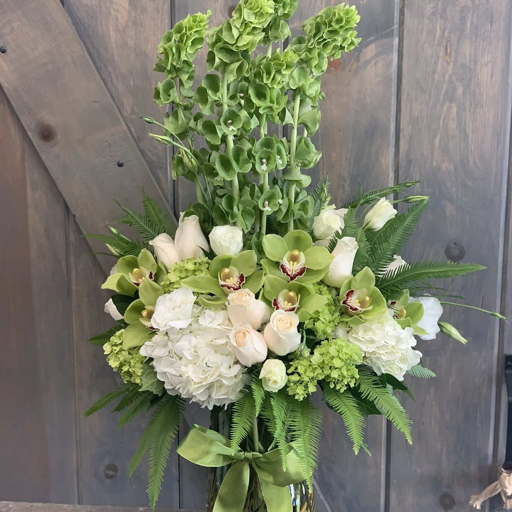 This elegant and sophicated floral display includes Umbrella fern, White hydrangea, White, photo 2 of 2