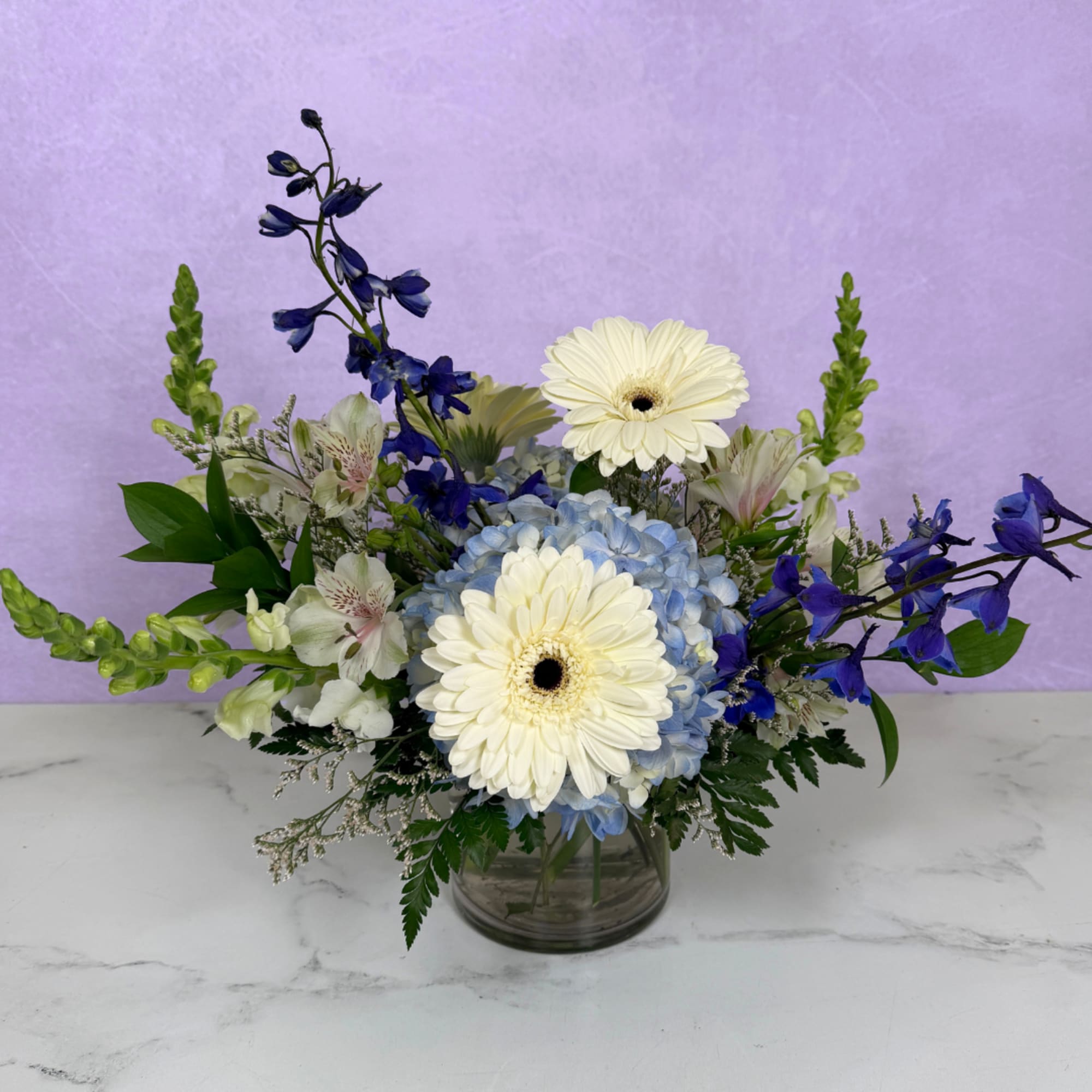 Whispering Winds Cylinder by Savilles Florist is a stunning display of blue, photo 2 of 3