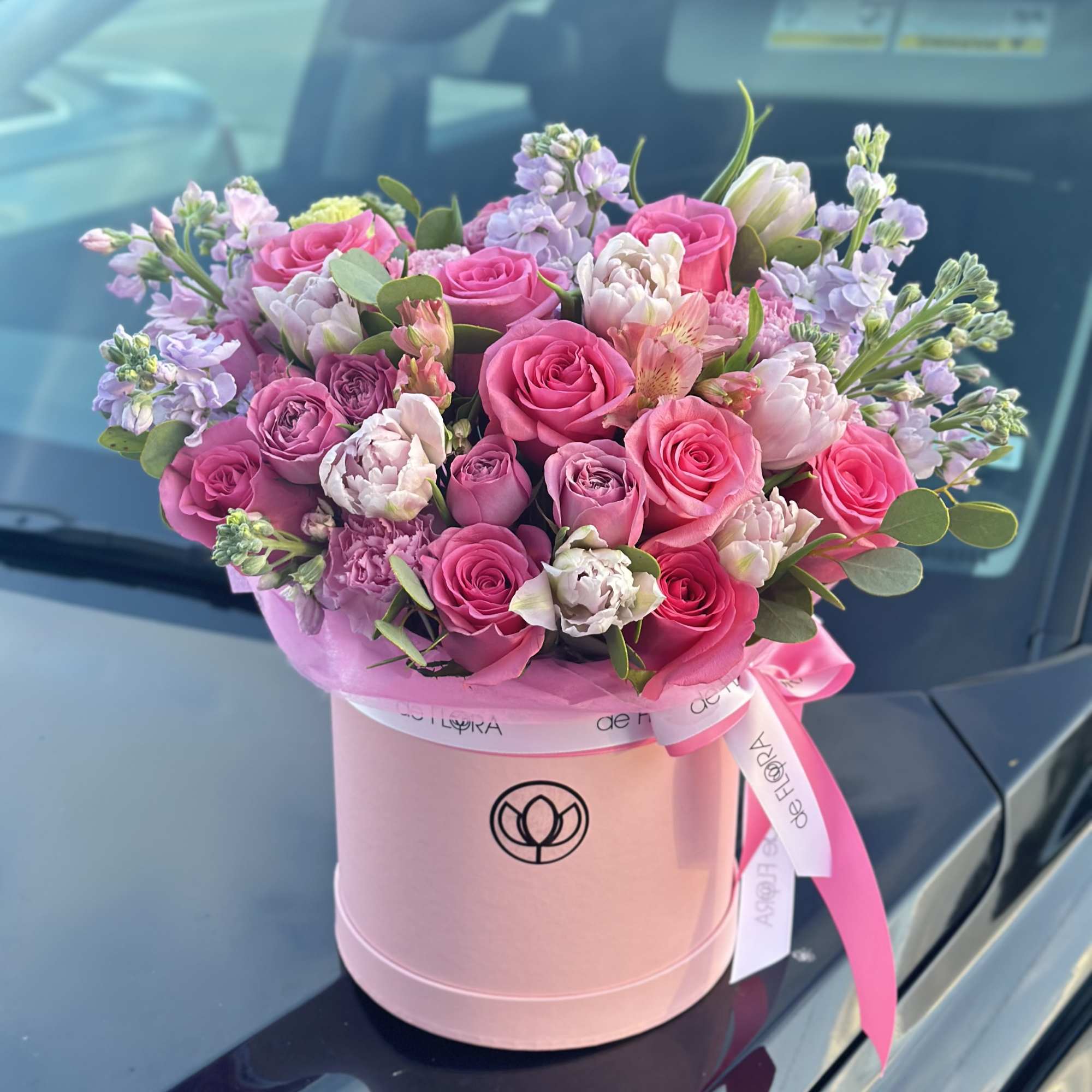 Pink and lavender rose bouquet in a round pink box with ribbon, photo 2 of 6