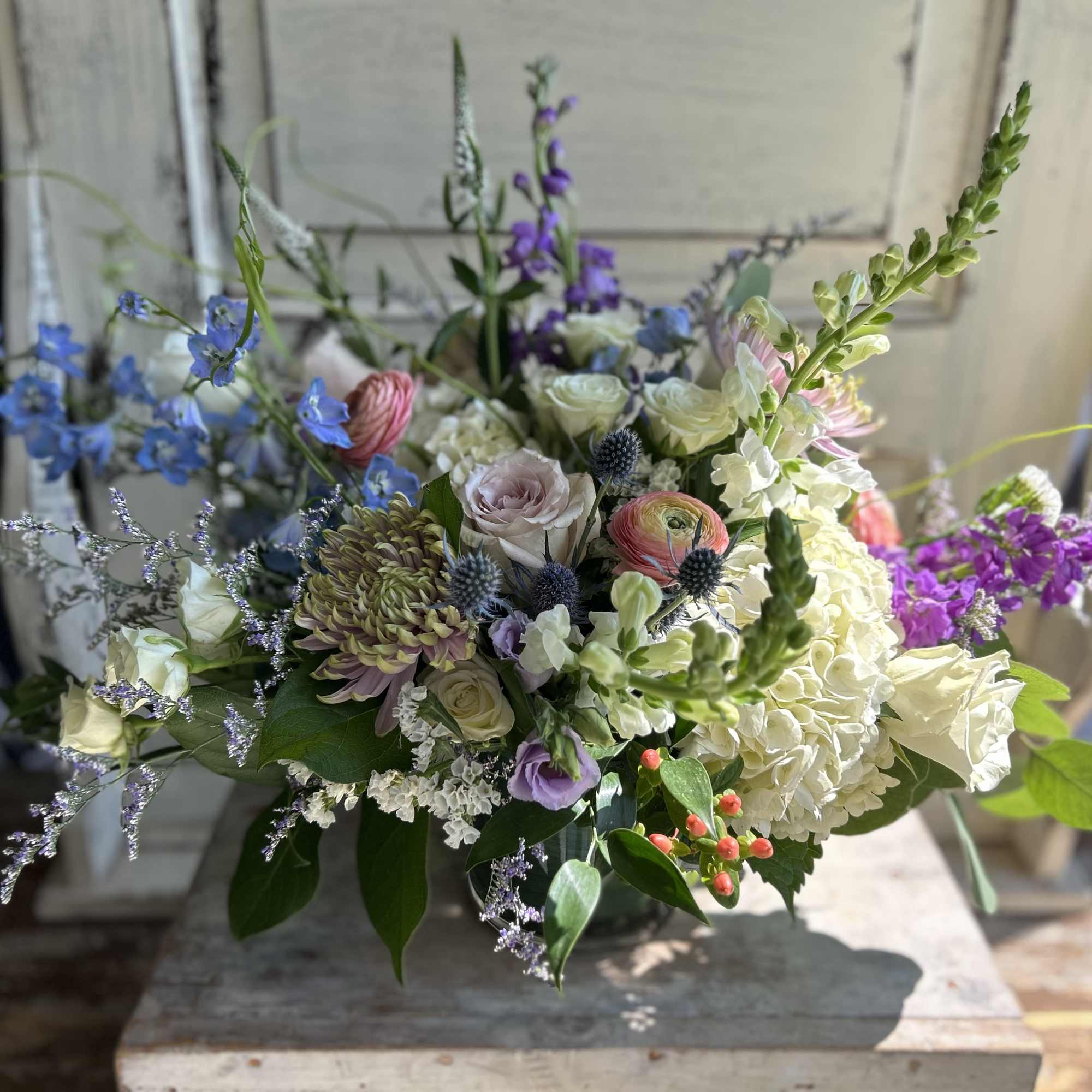 Mixed bouquet with blue, white, pink, and purple flowers