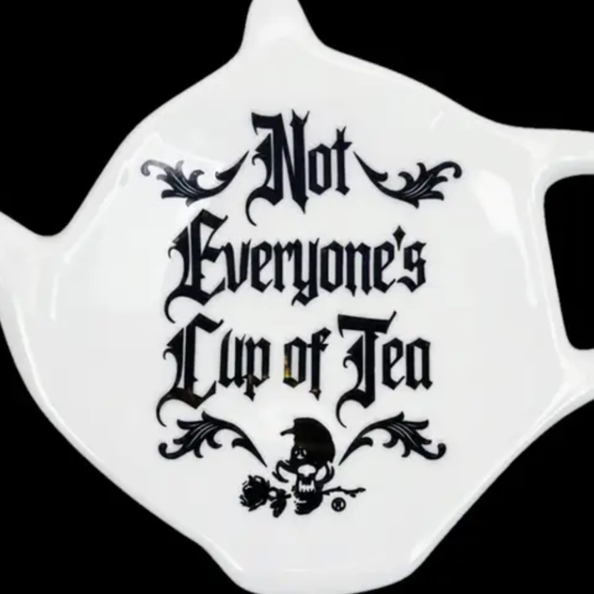 White teapot with black text reading "Not Everyone's Cup of Tea"