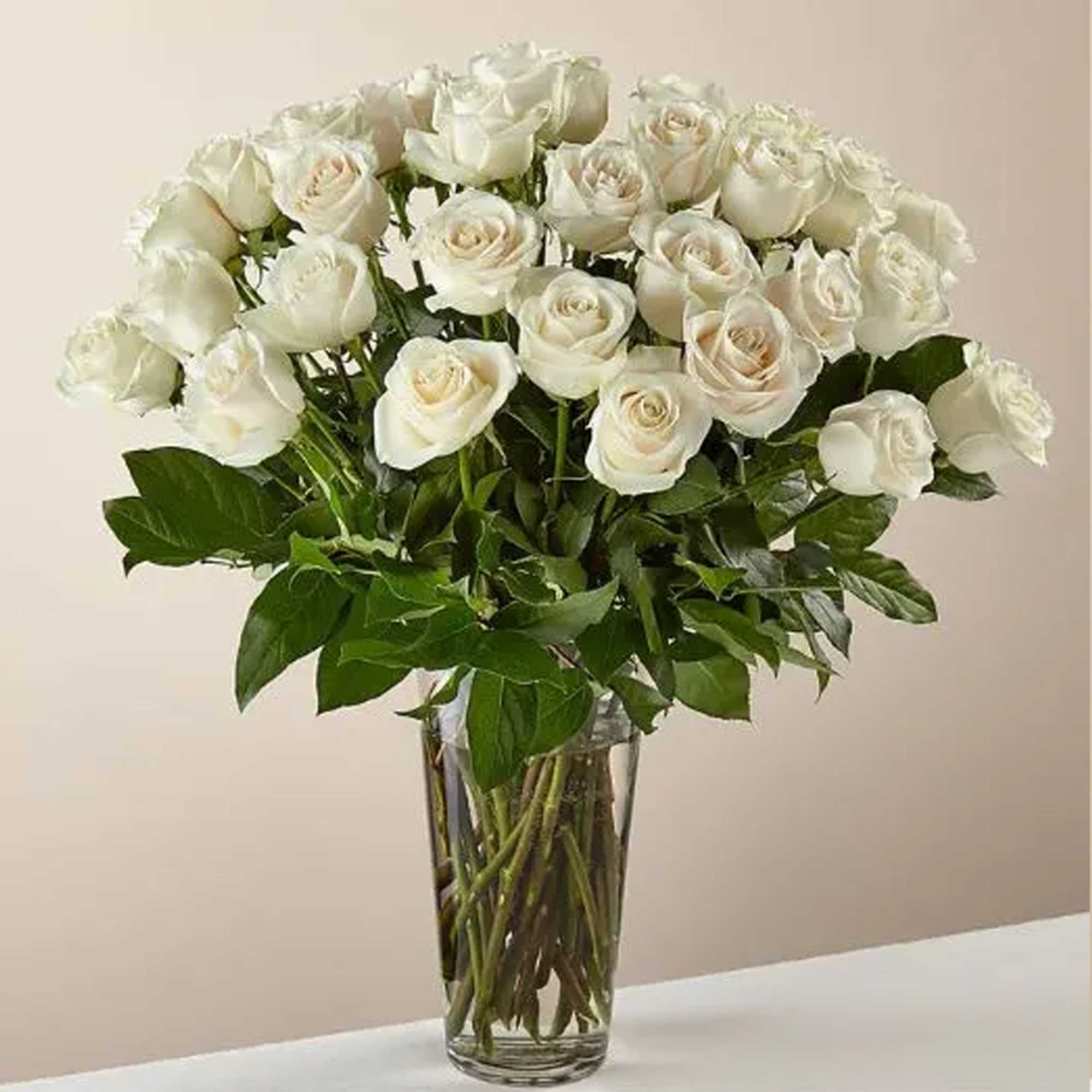 Bouquet of white roses in a clear glass vase