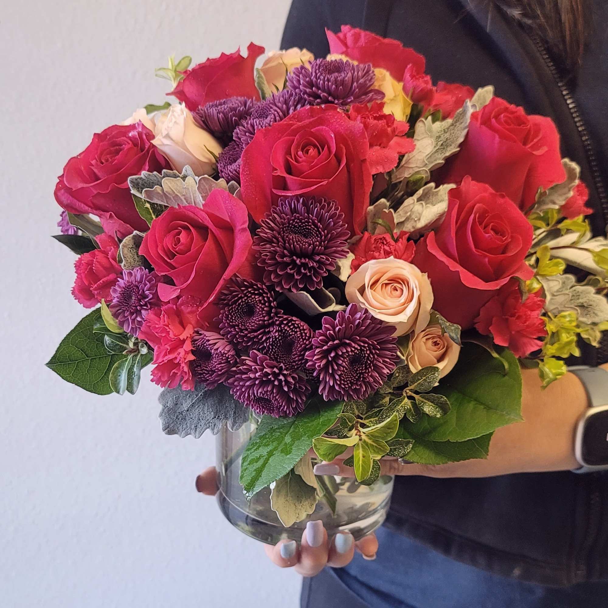 This stunning arrangement features deep red Roses, complemented by vibrant pink Carnations, photo 2 of 2
