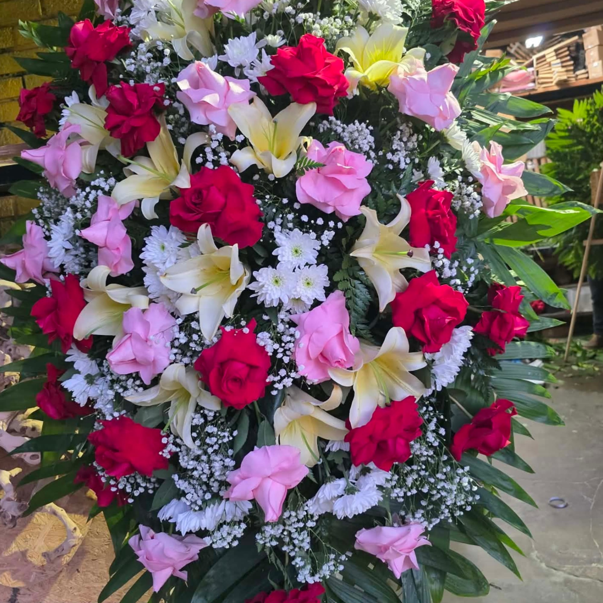 Funeral arrangement with red and pink roses and lilis  . Perfect, photo 2 of 2
