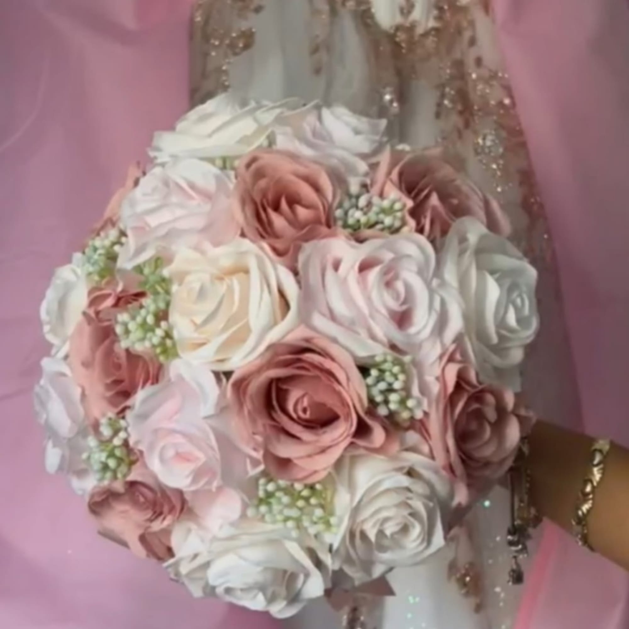 Bouquet of blush and white roses with pearl-like filler
