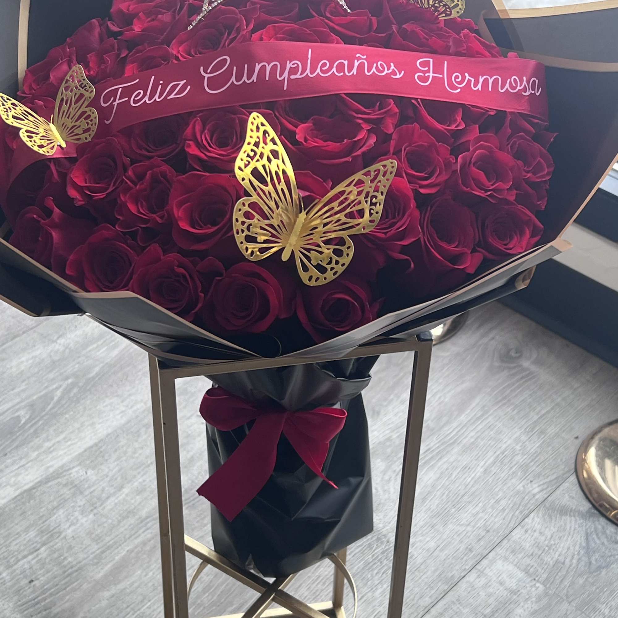 A bold block of deep red roses packed tightly into a black