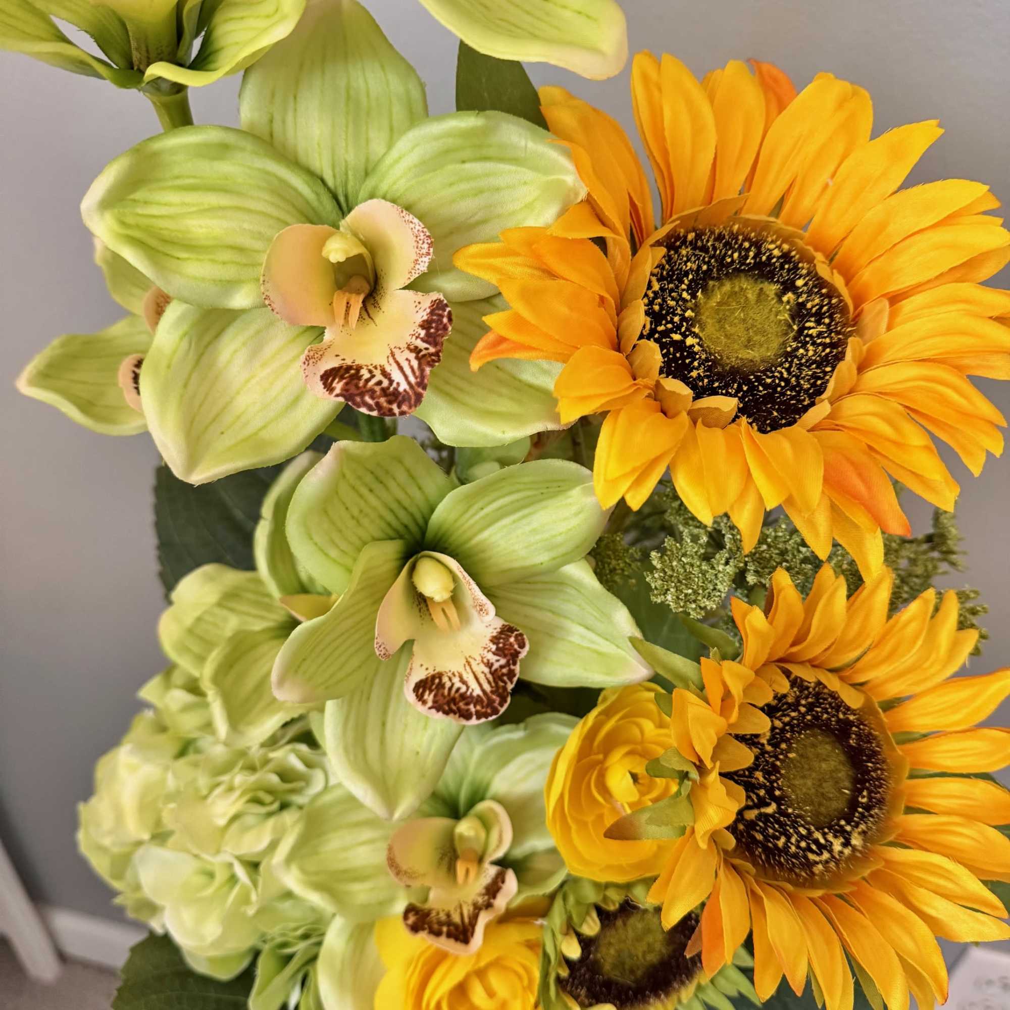 Bouquet of green orchids and yellow sunflowers, photo 4 of 6