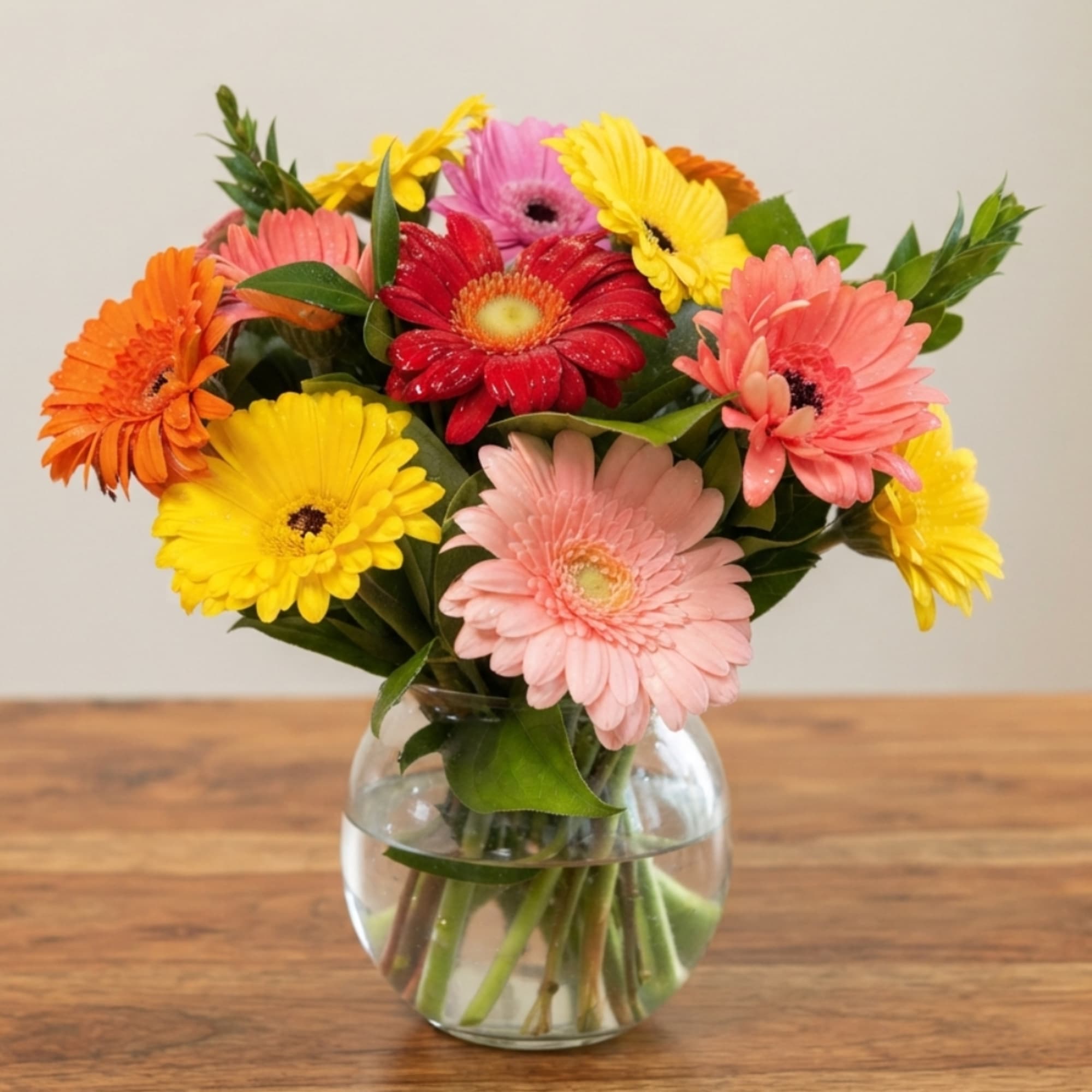Colorful gerbera daisy bouquet in a clear glass vase, photo 5 of 5