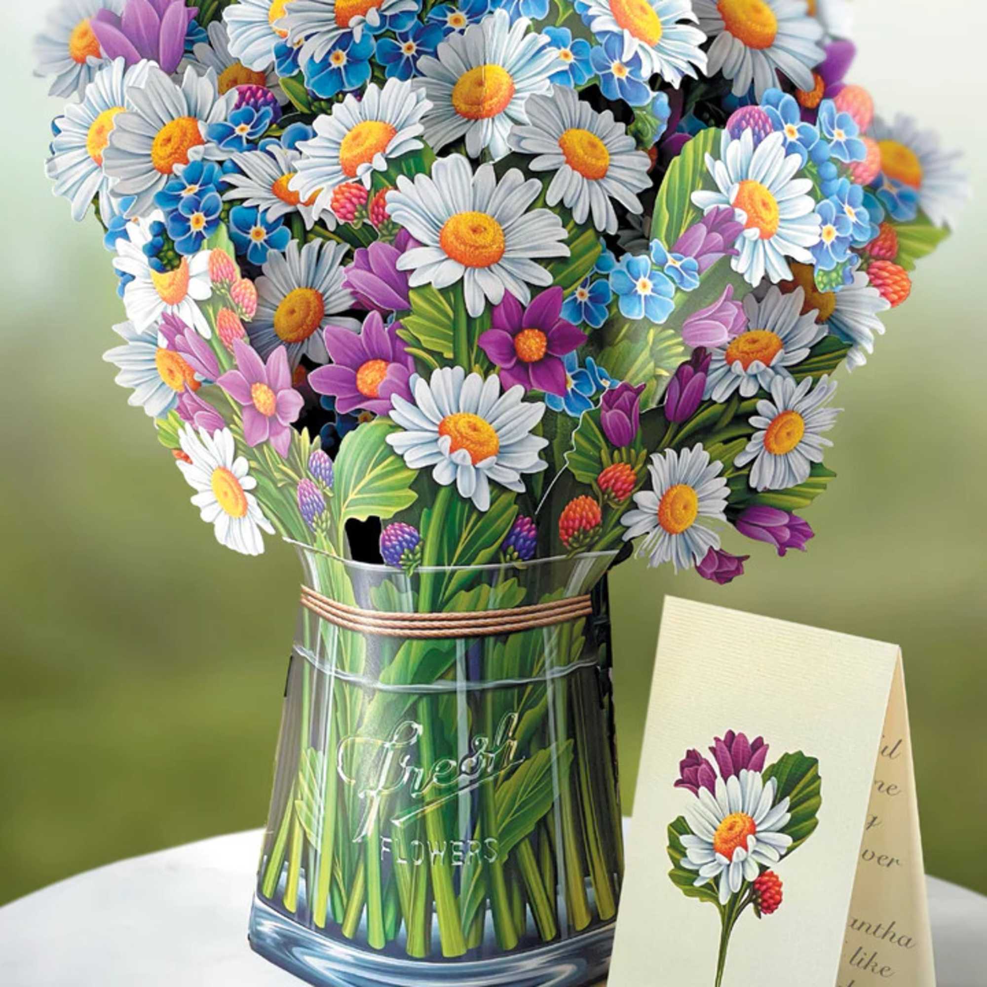 Stunning paper floral bouquet pops open and brings color to any room.