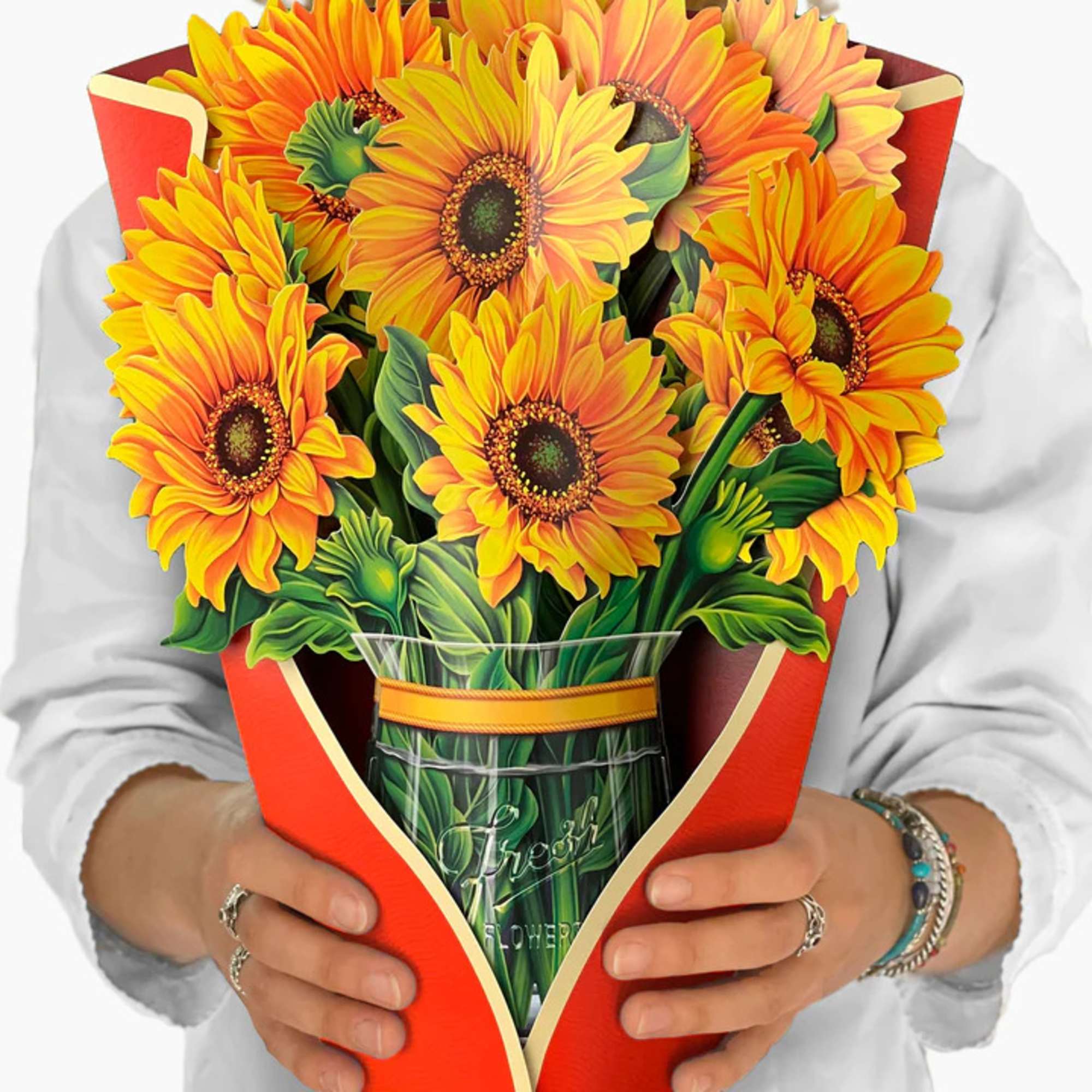 Bouquet of bright yellow-orange sunflowers wrapped in red paper