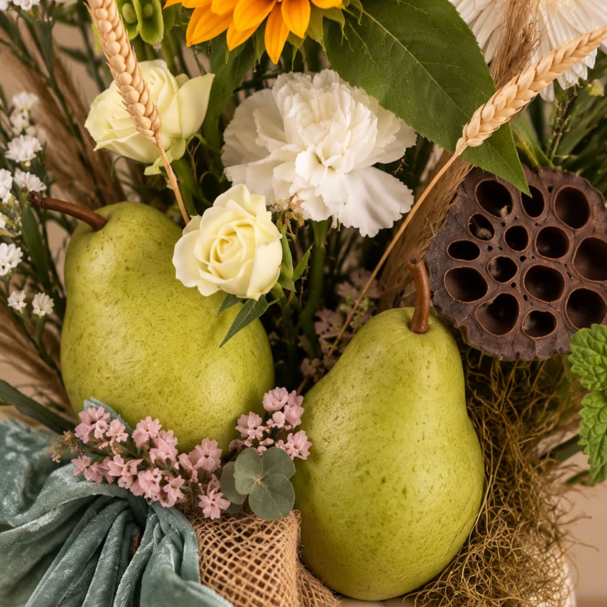 Floral arrangement with pears, white roses, and a white carnation