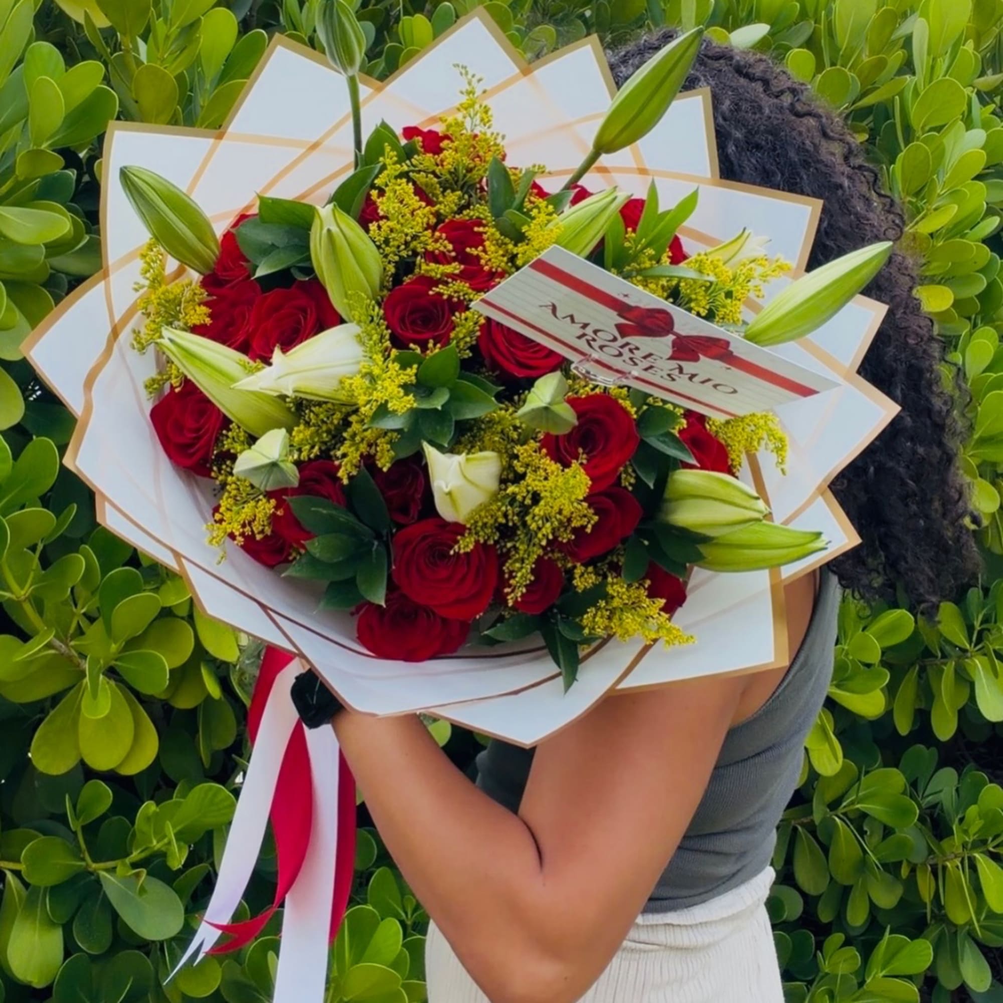 Bouquet of red roses and white lilies wrapped in white paper, photo 4 of 4