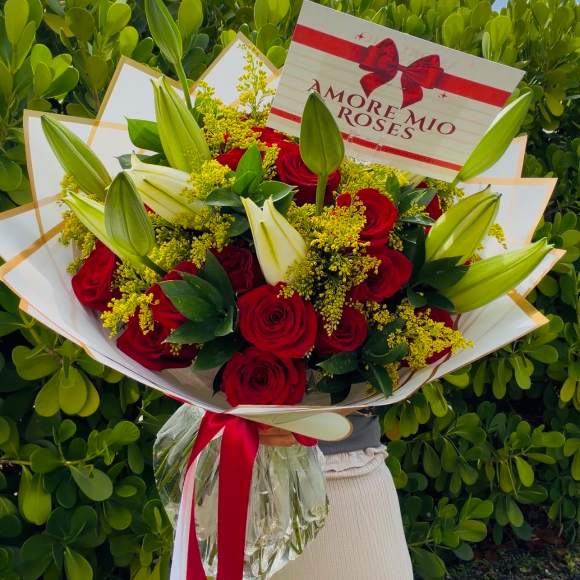 Bouquet of red roses and white lilies wrapped in white paper, photo 2 of 4