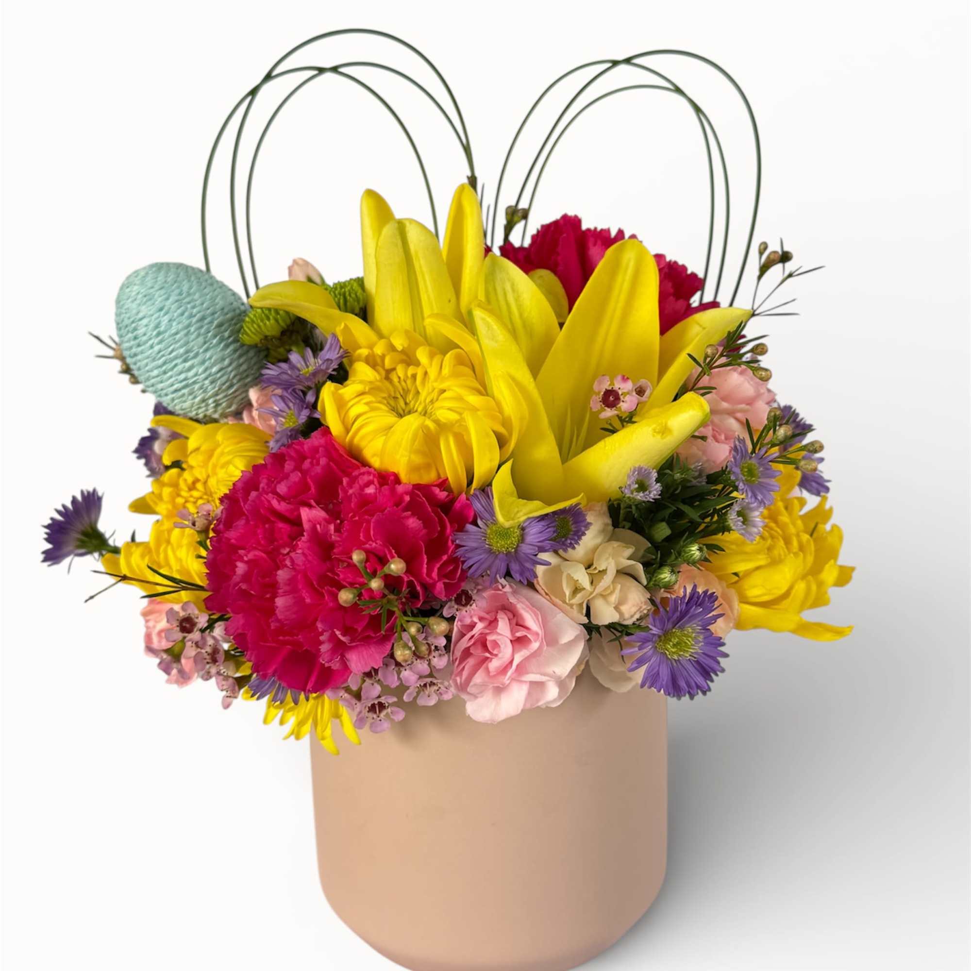 Bursting with cheerful color and seasonal charm, this arrangement features vibrant yellow