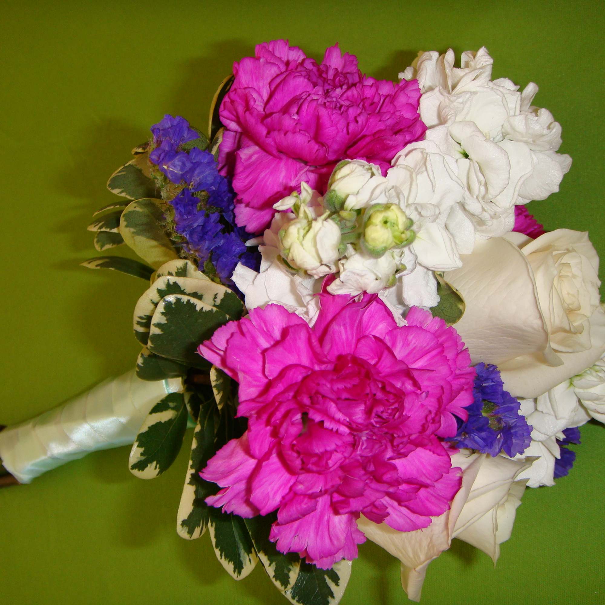 Bouquet of pink and white flowers with blue accents