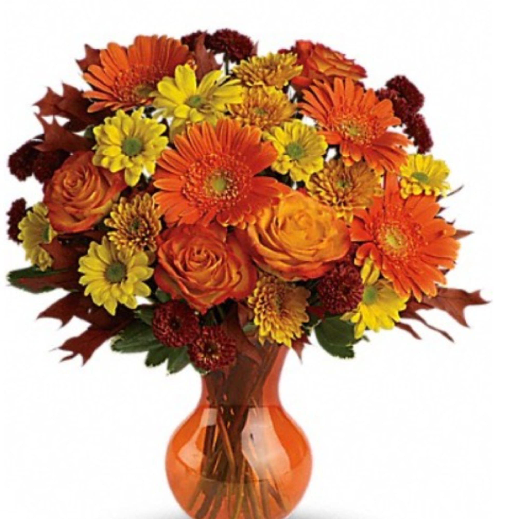 Orange and yellow mixed bouquet in an amber glass vase