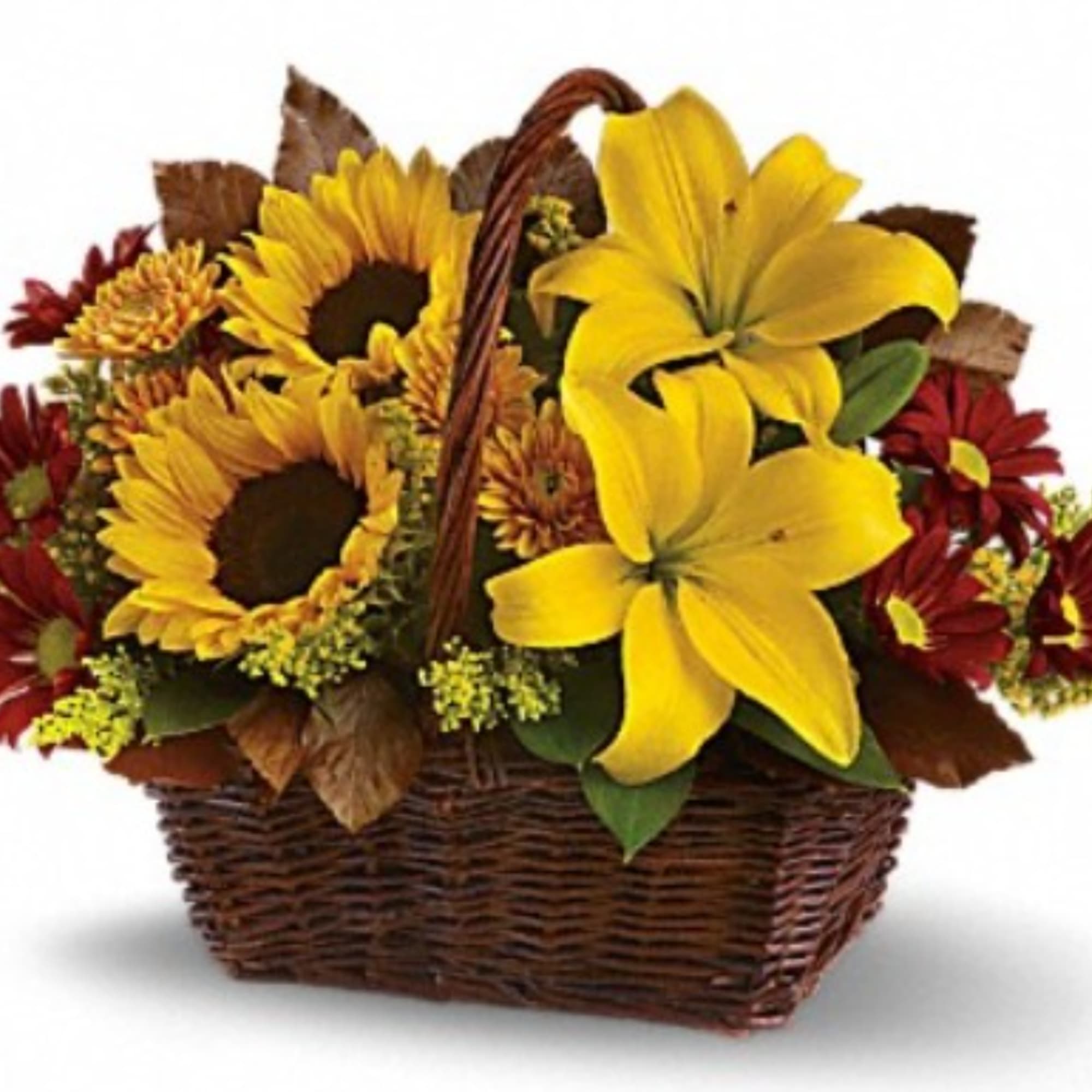 Basket arrangement with yellow lilies, sunflowers, and red daisies