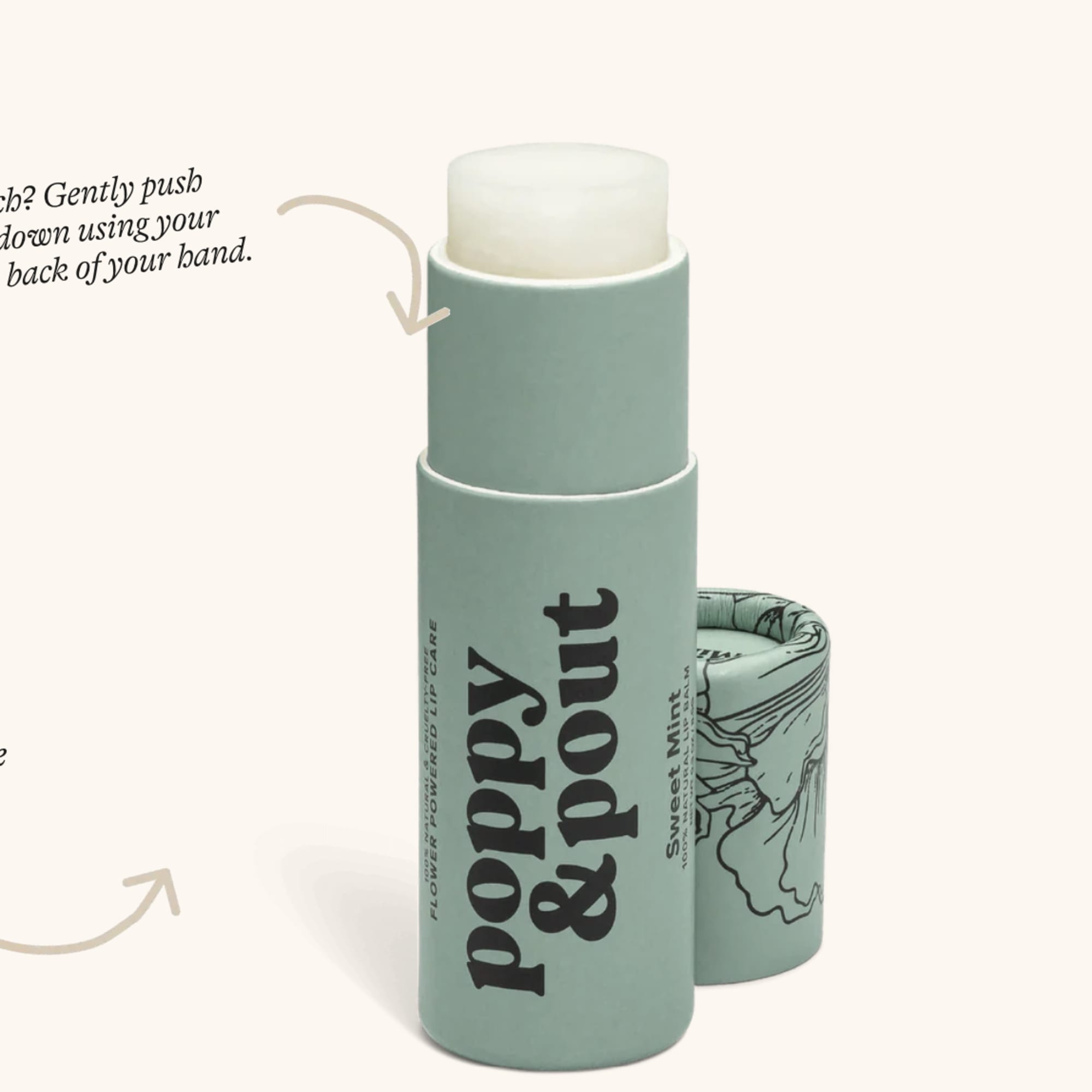 Mint lip balm in a cardboard tube with printed instructions