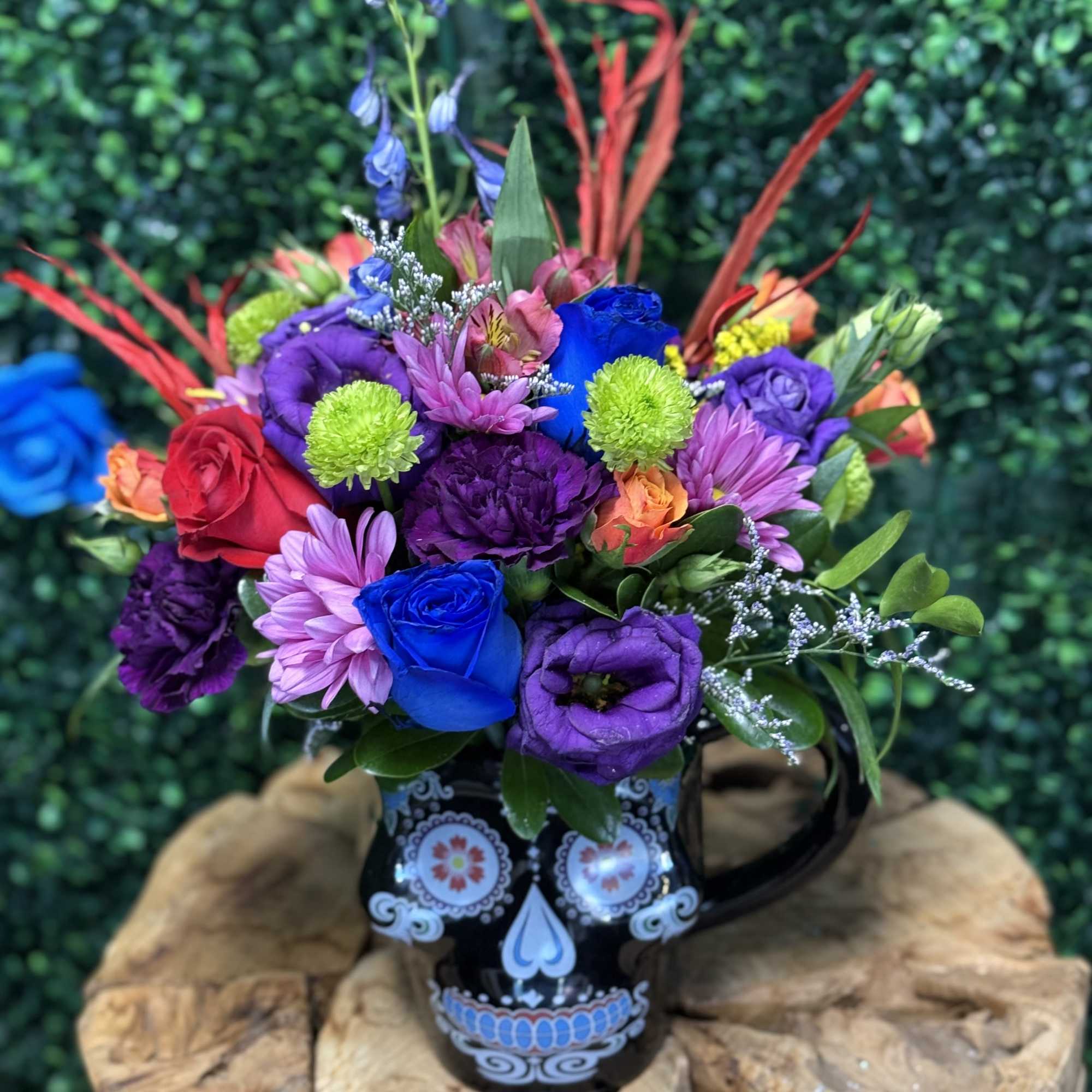 Colorful mixed bouquet in a decorative black mug