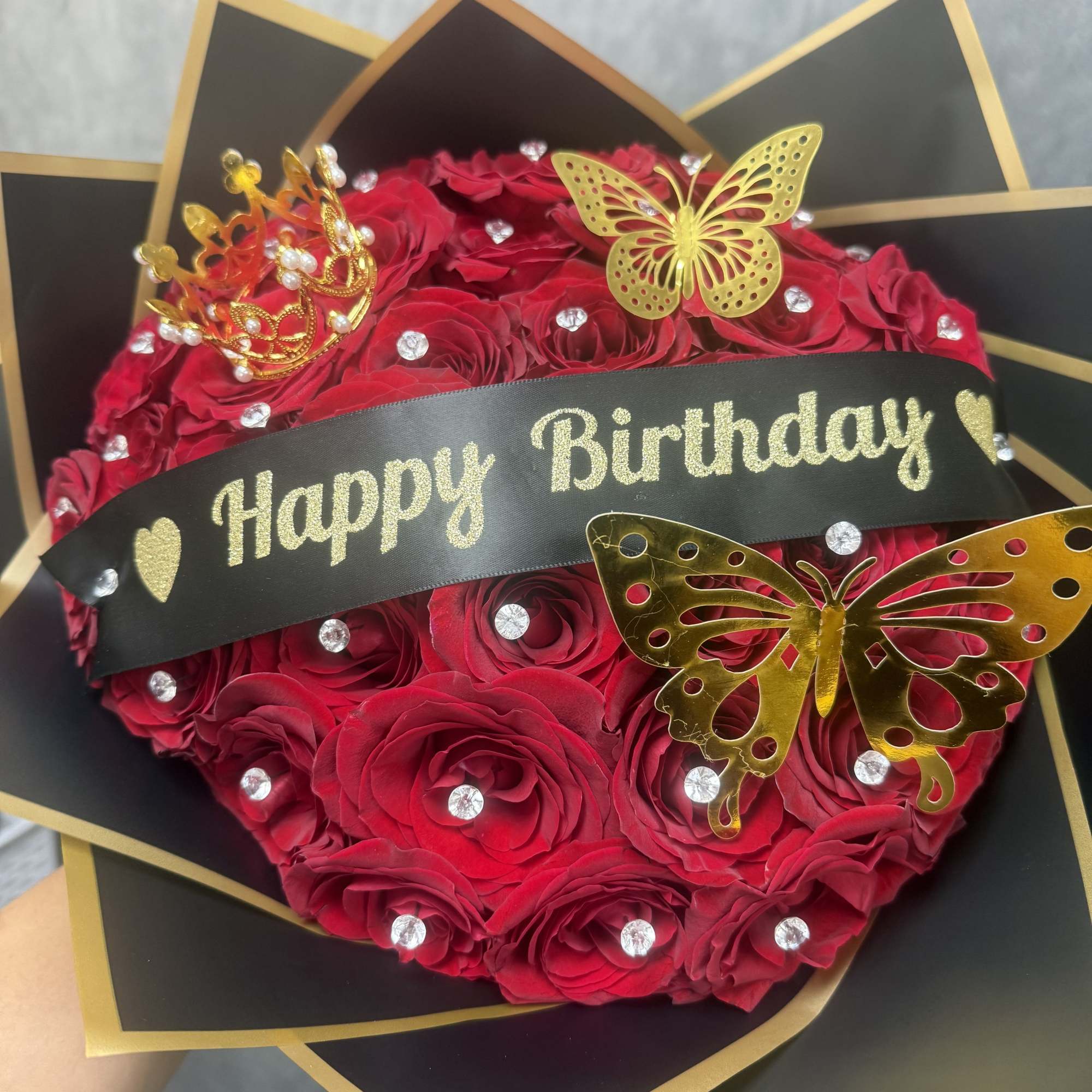 Fit for royalty, our Birthday Queen Bouquet features luxurious red roses adorned