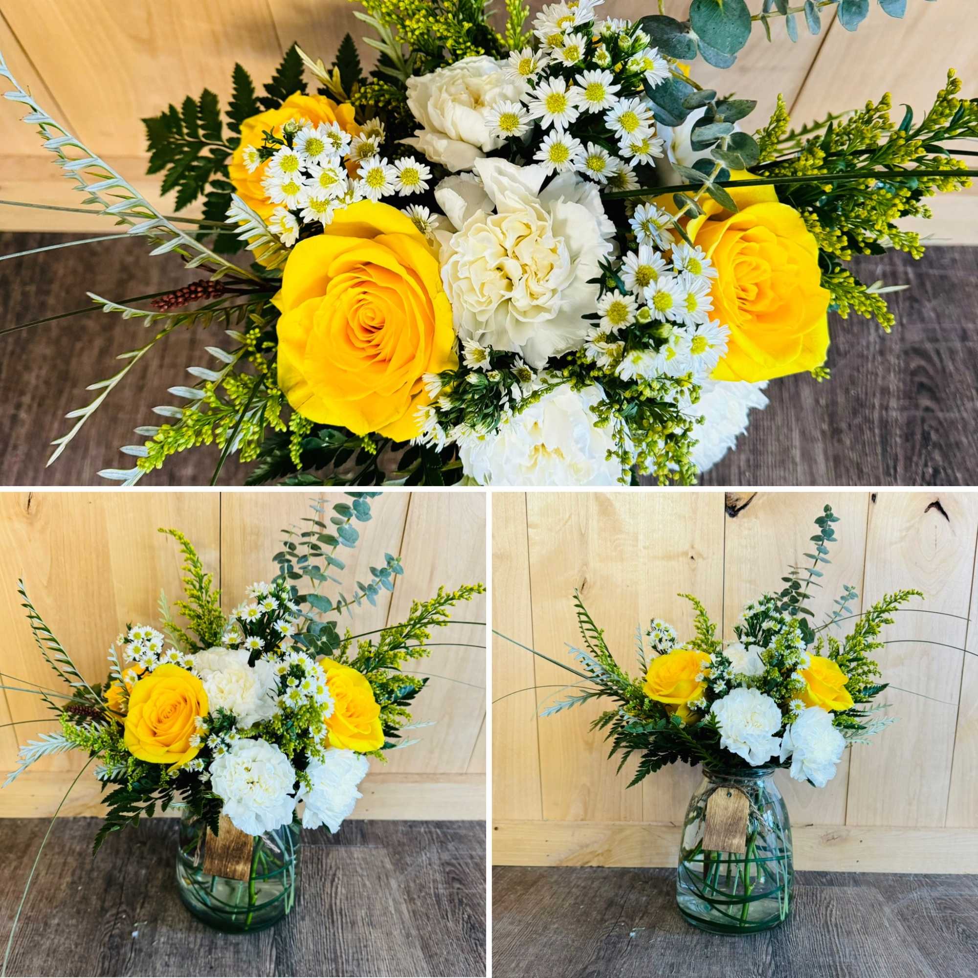 Yellow roses and white flowers in a glass vase