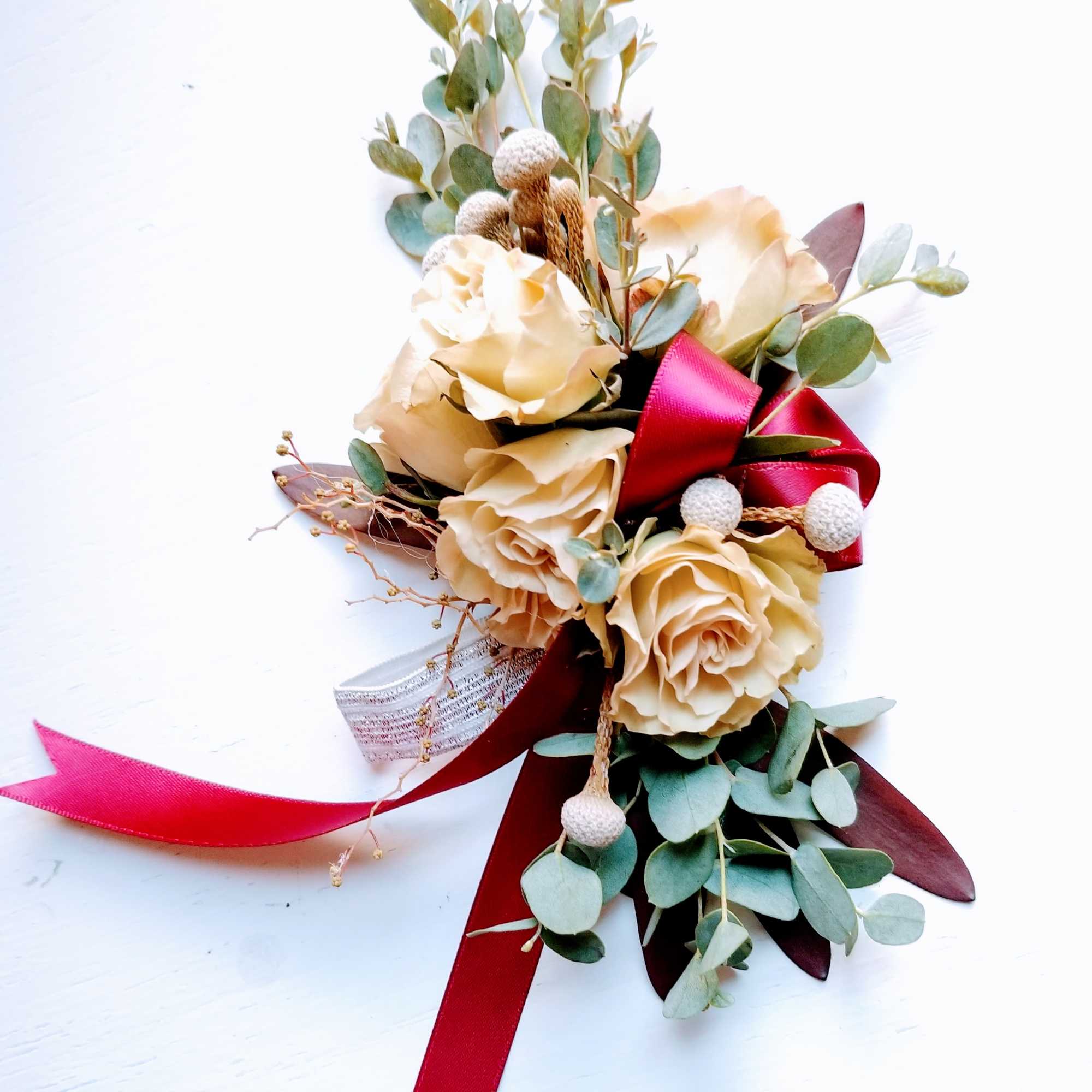 Cream rose bouquet with eucalyptus and burgundy ribbon