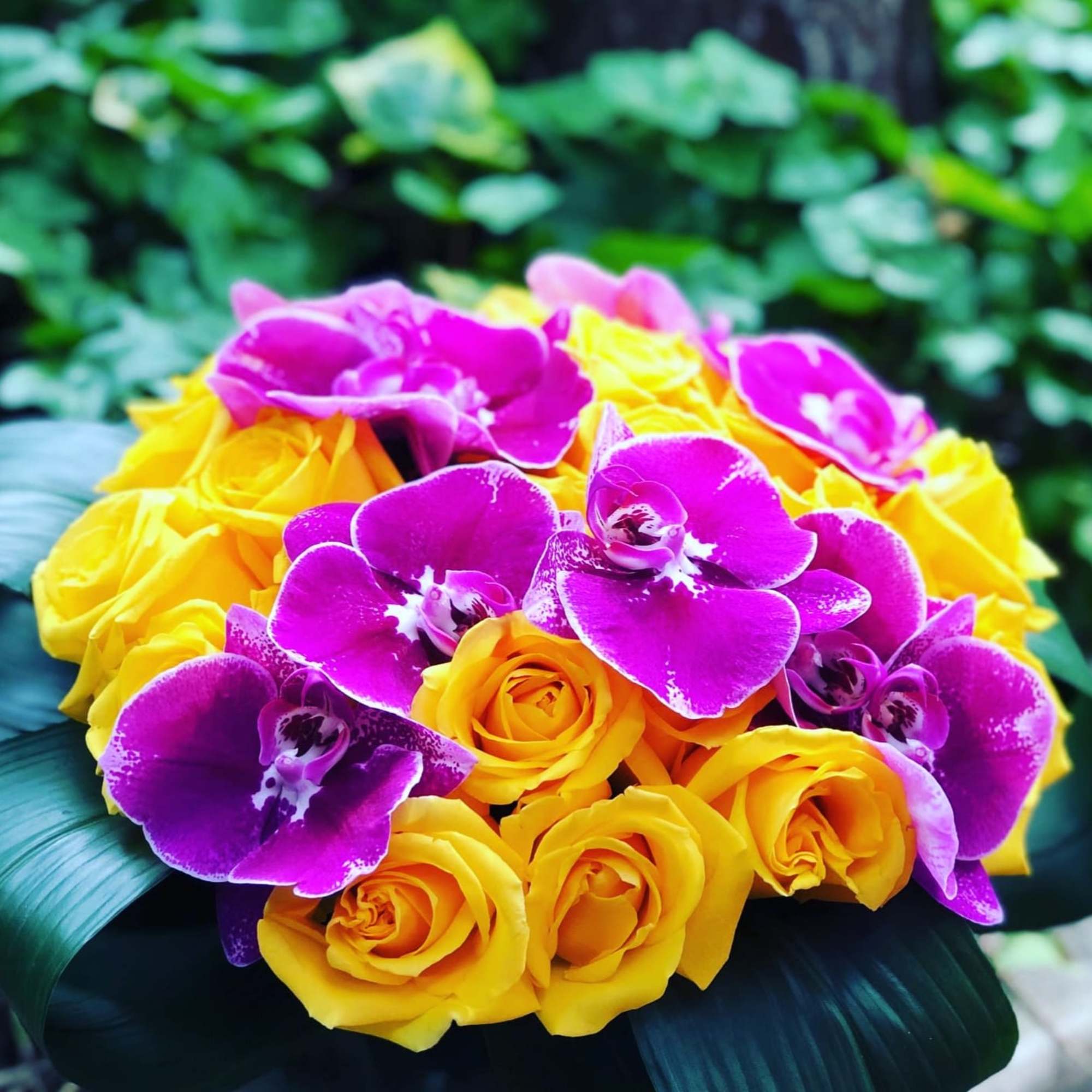 Bouquet of yellow roses and purple orchids, photo 2 of 2