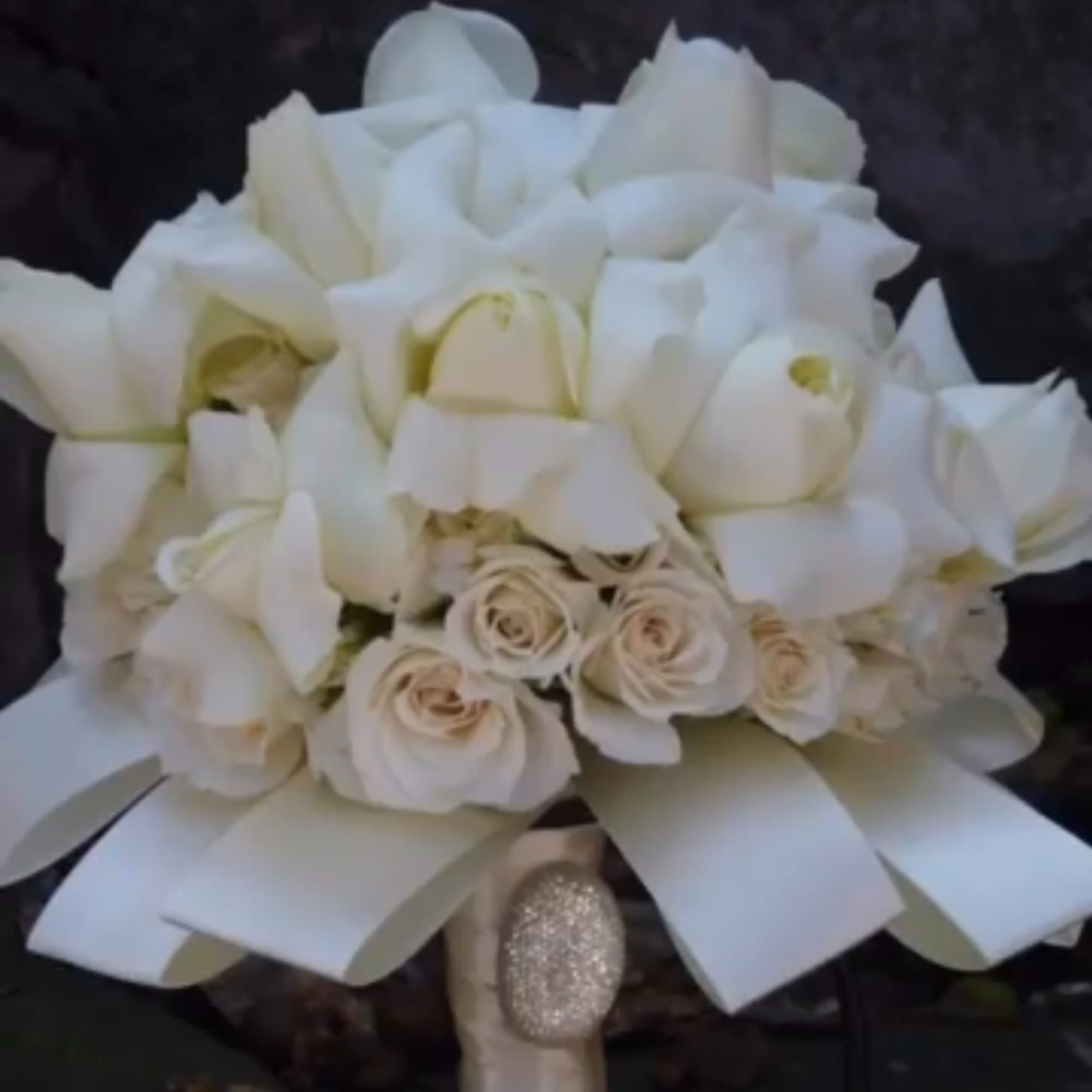 White rose and calla lily bouquet with a satin ribbon wrap