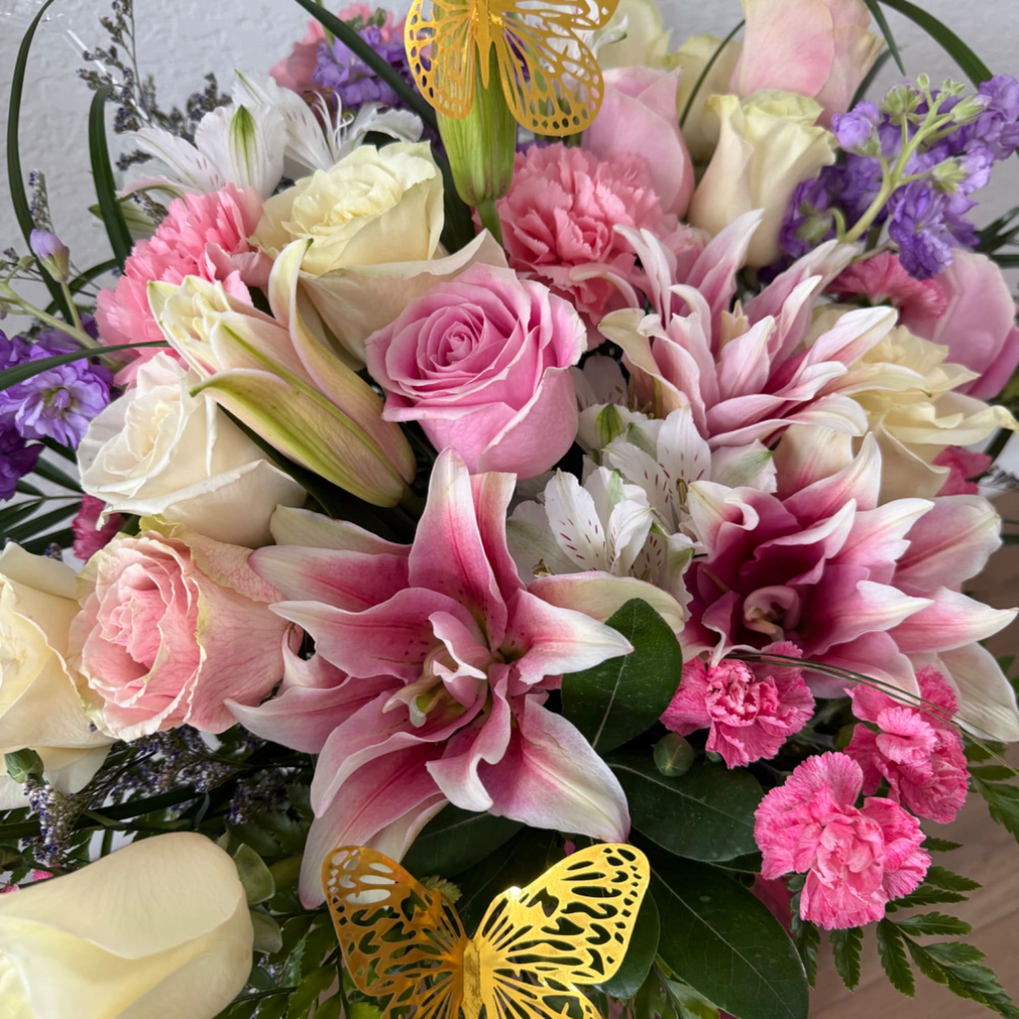 Pink and cream bouquet with lilies, roses, and carnations