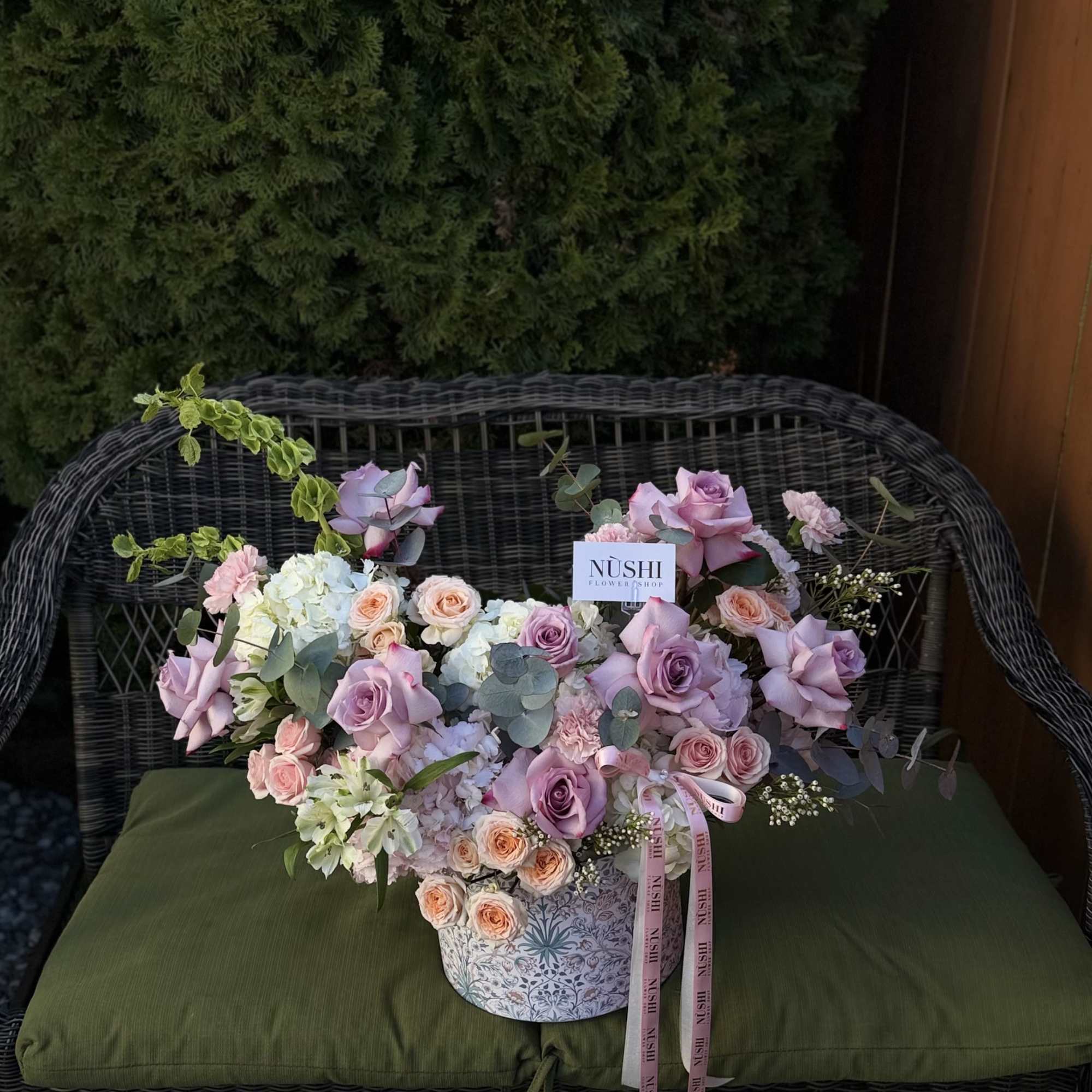 The Secret Garden Arrangement is a romantic floral design arranged in an