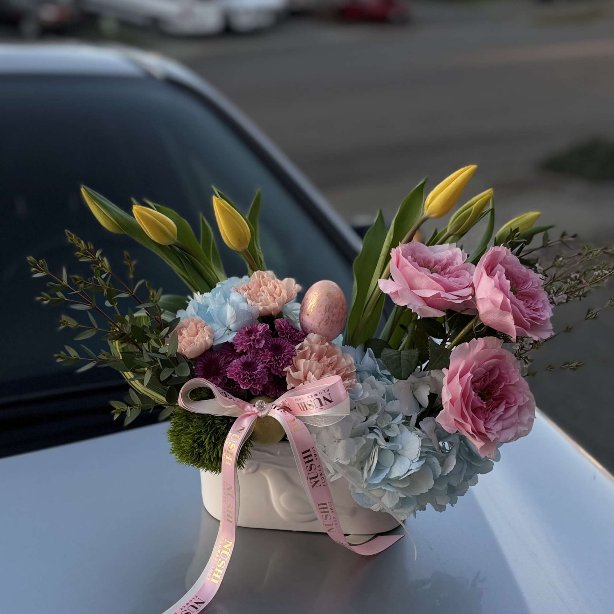 Easter Morning is a soft pastel floral arrangement in a basket and
